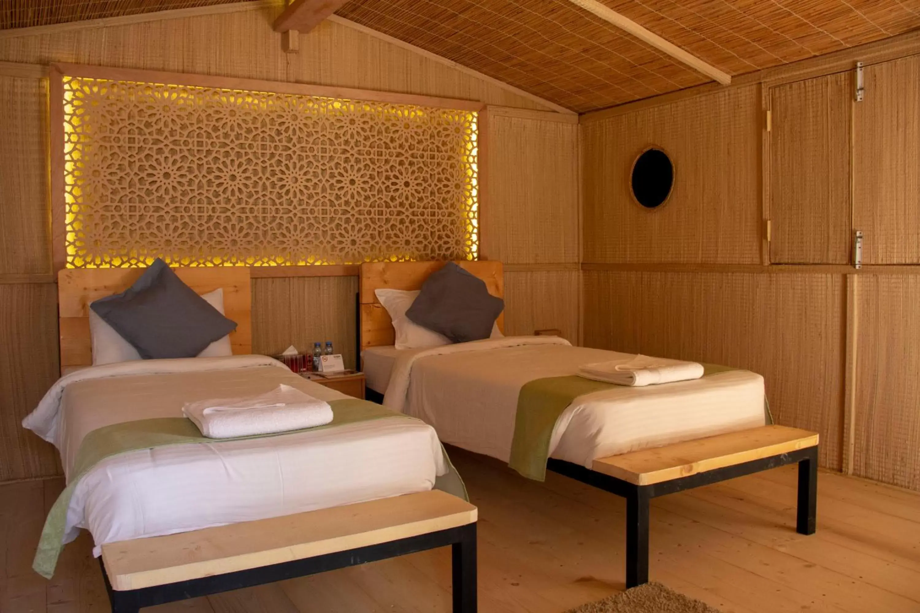 Bed in SAMA Ras Al Jinz Resort