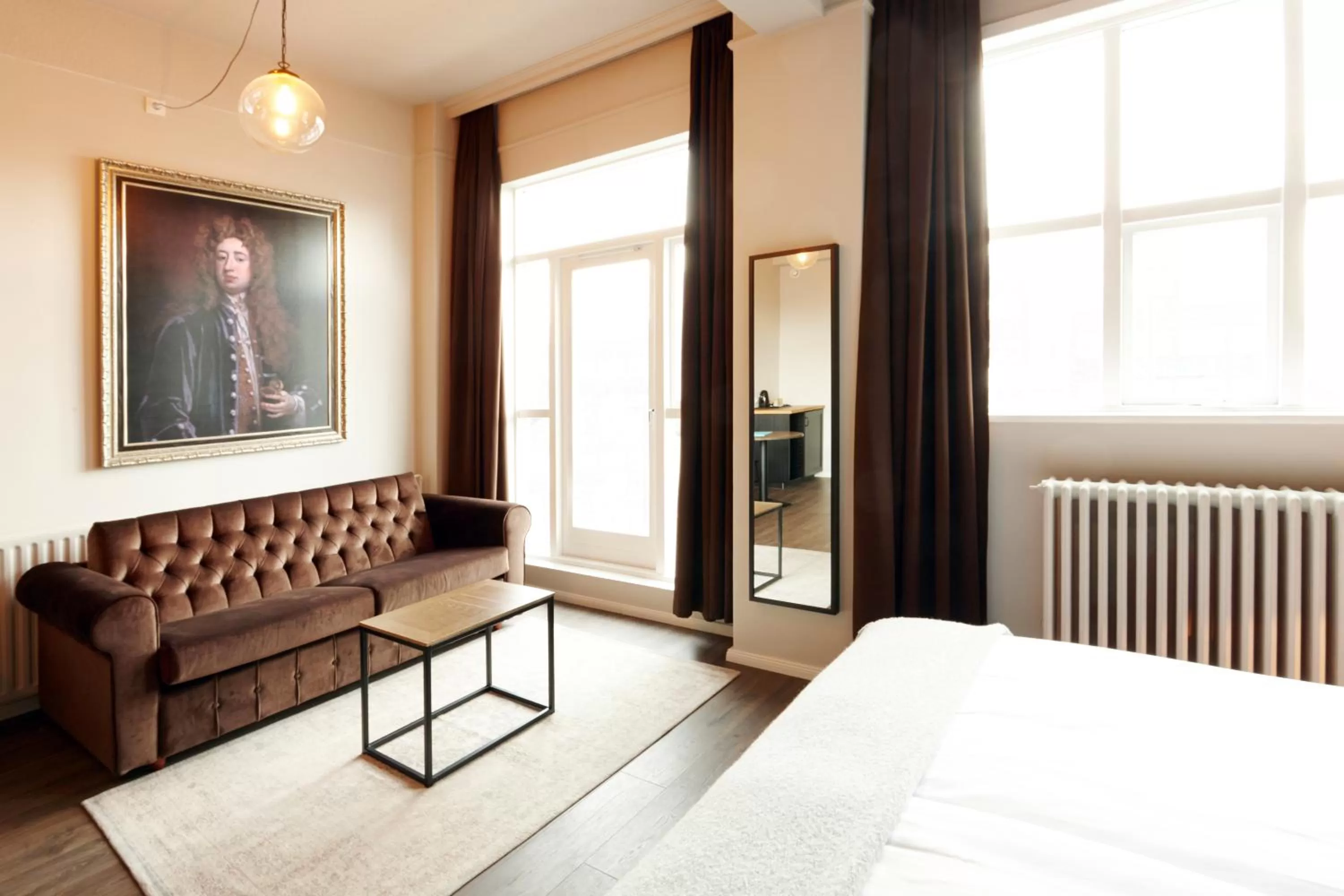 Seating area, Bed in Fosshotel Baron