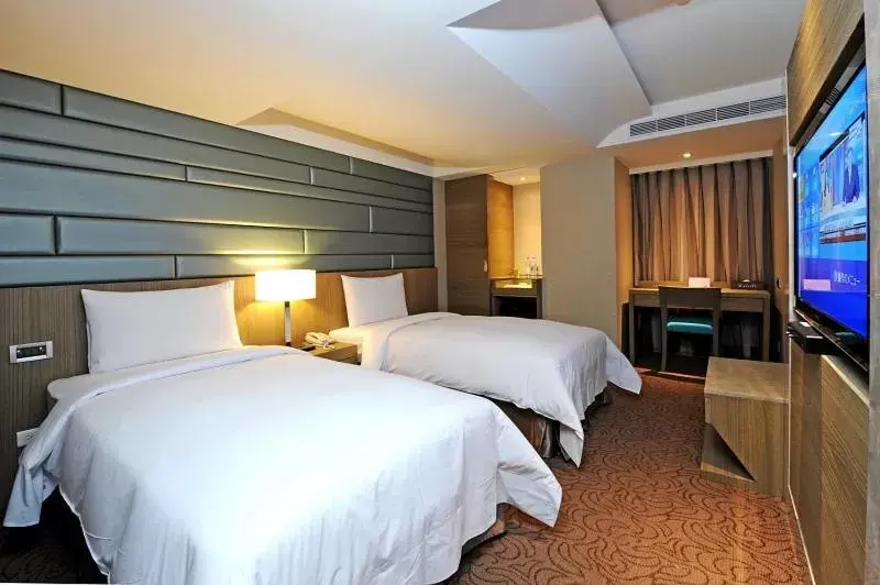 Bed in International Citizen Hotel