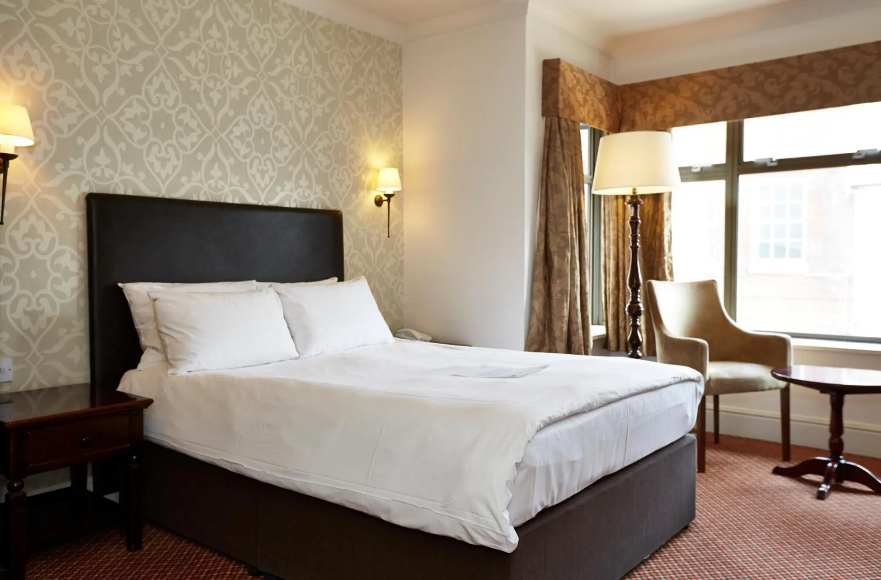 Bed in Ye Olde Talbot Hotel by Greene King Inns