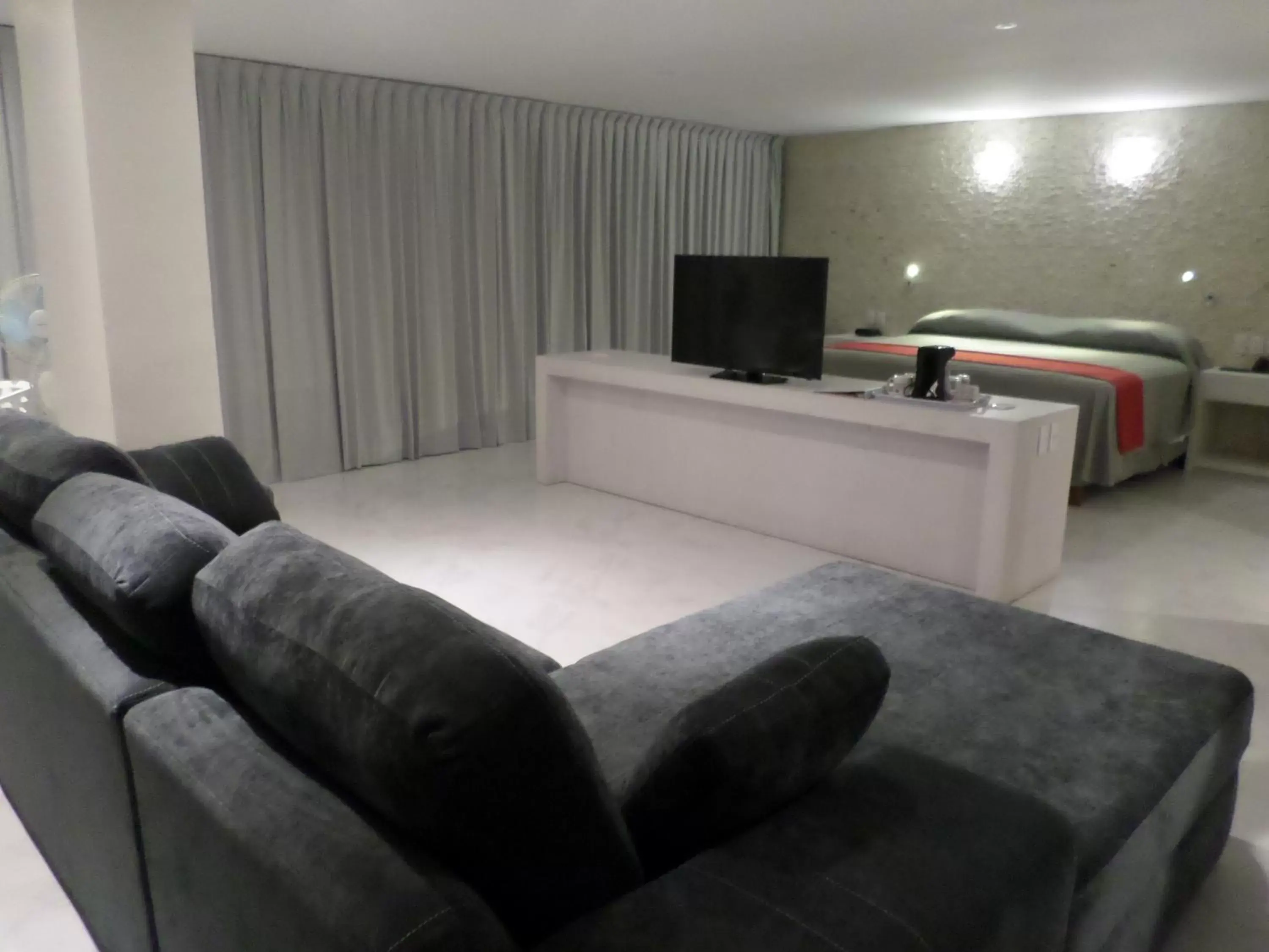 Photo of the whole room, TV/Entertainment Center in We Hotel Acapulco