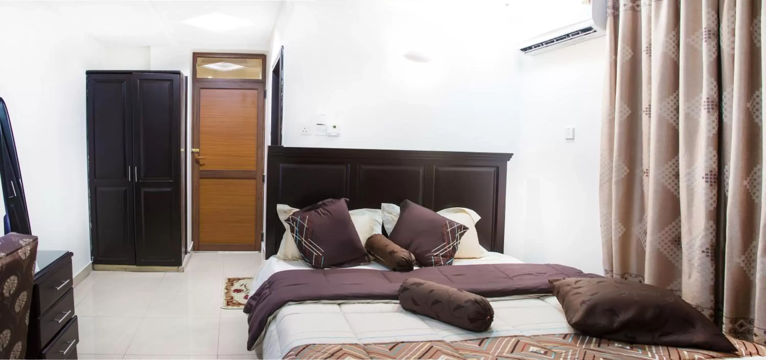 Bed, Seating Area in Sleep Inn Hotel - Kariakoo