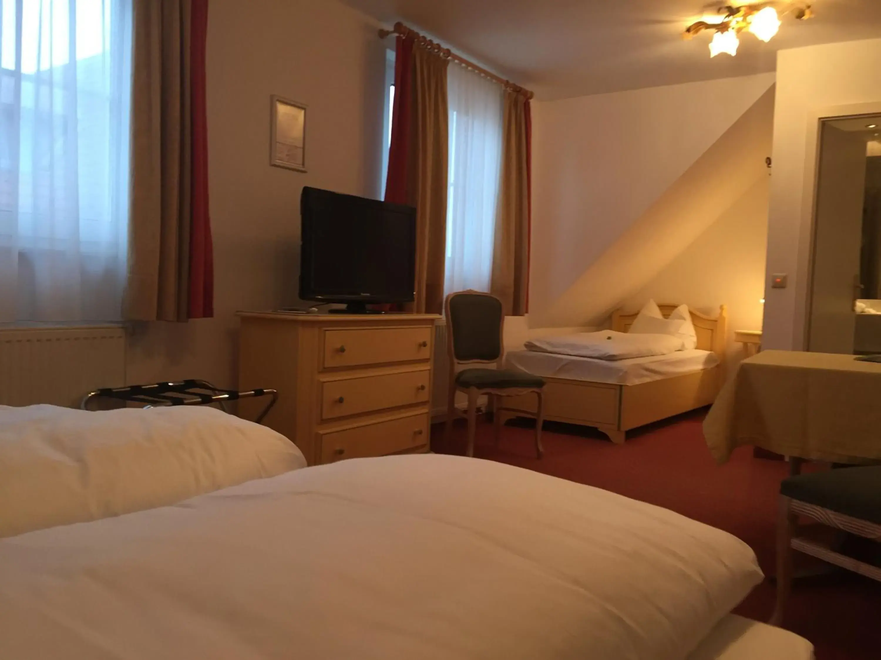 Photo of the whole room, Bed in Flair Hotel Vier Jahreszeiten