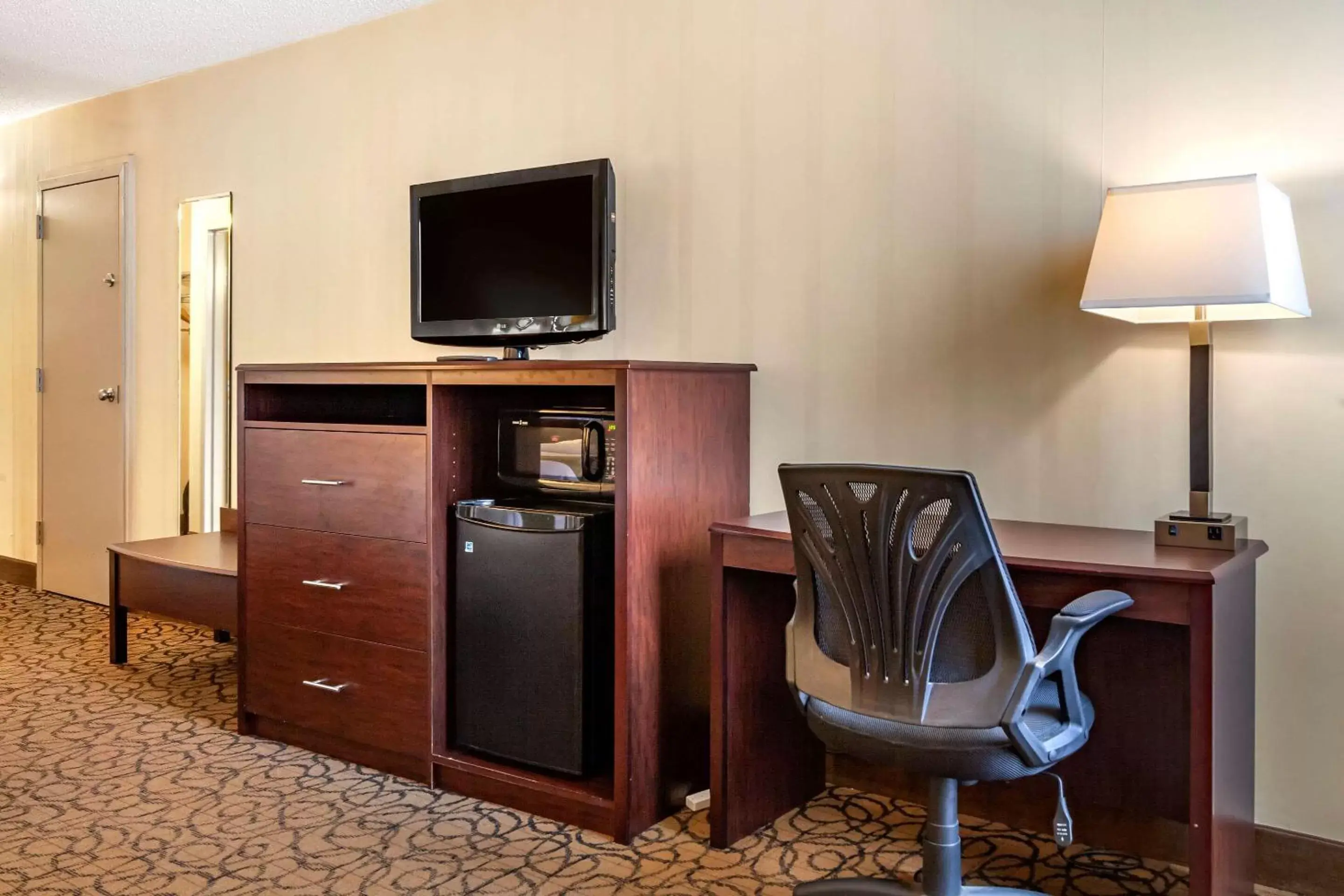 Photo of the whole room, TV/Entertainment Center in Quality Inn & Suites