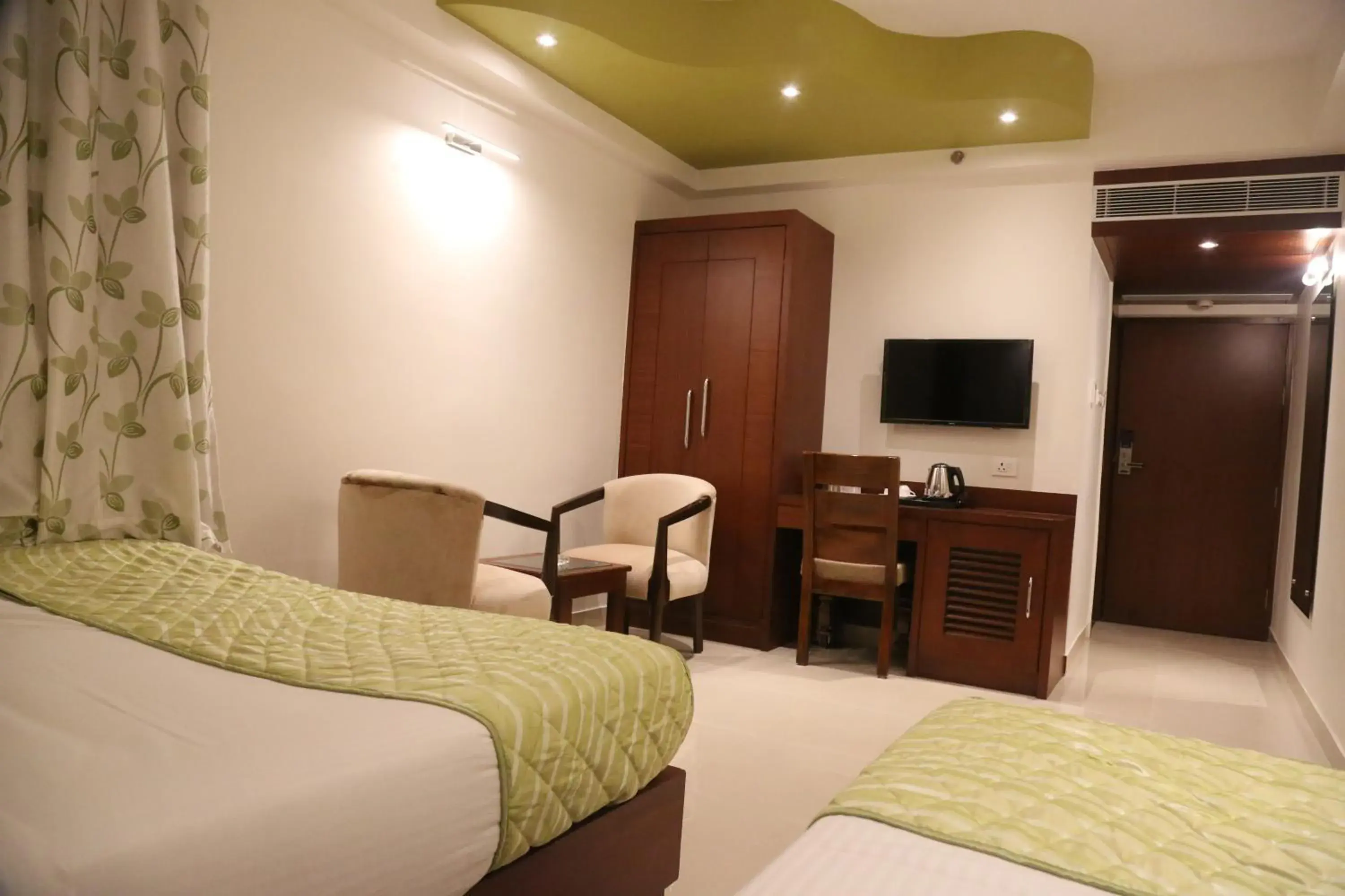 Photo of the whole room, Bed in Hotel Varanasi Inn