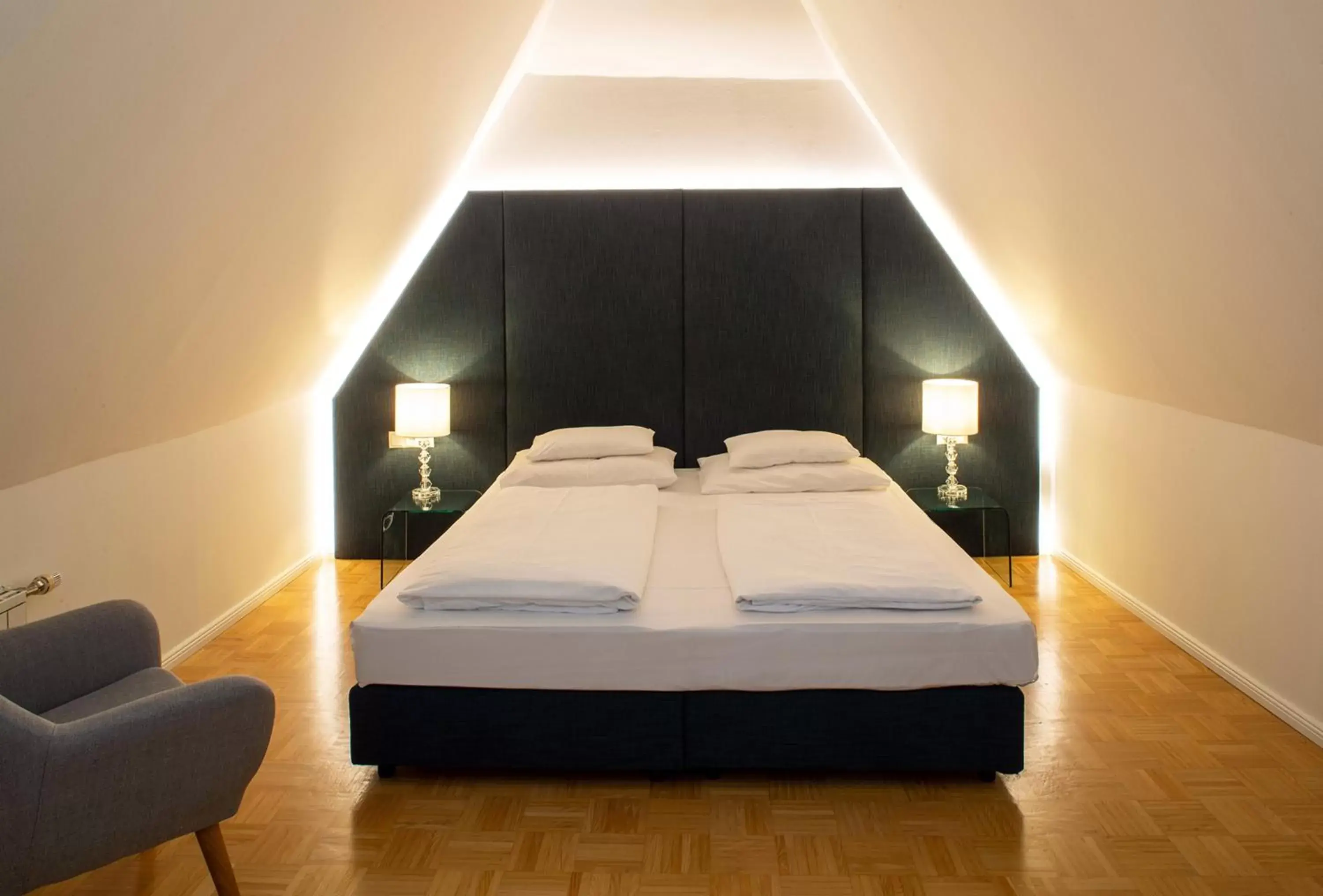 Bed in BoutiqueHotel Dom - Rooms & Suites