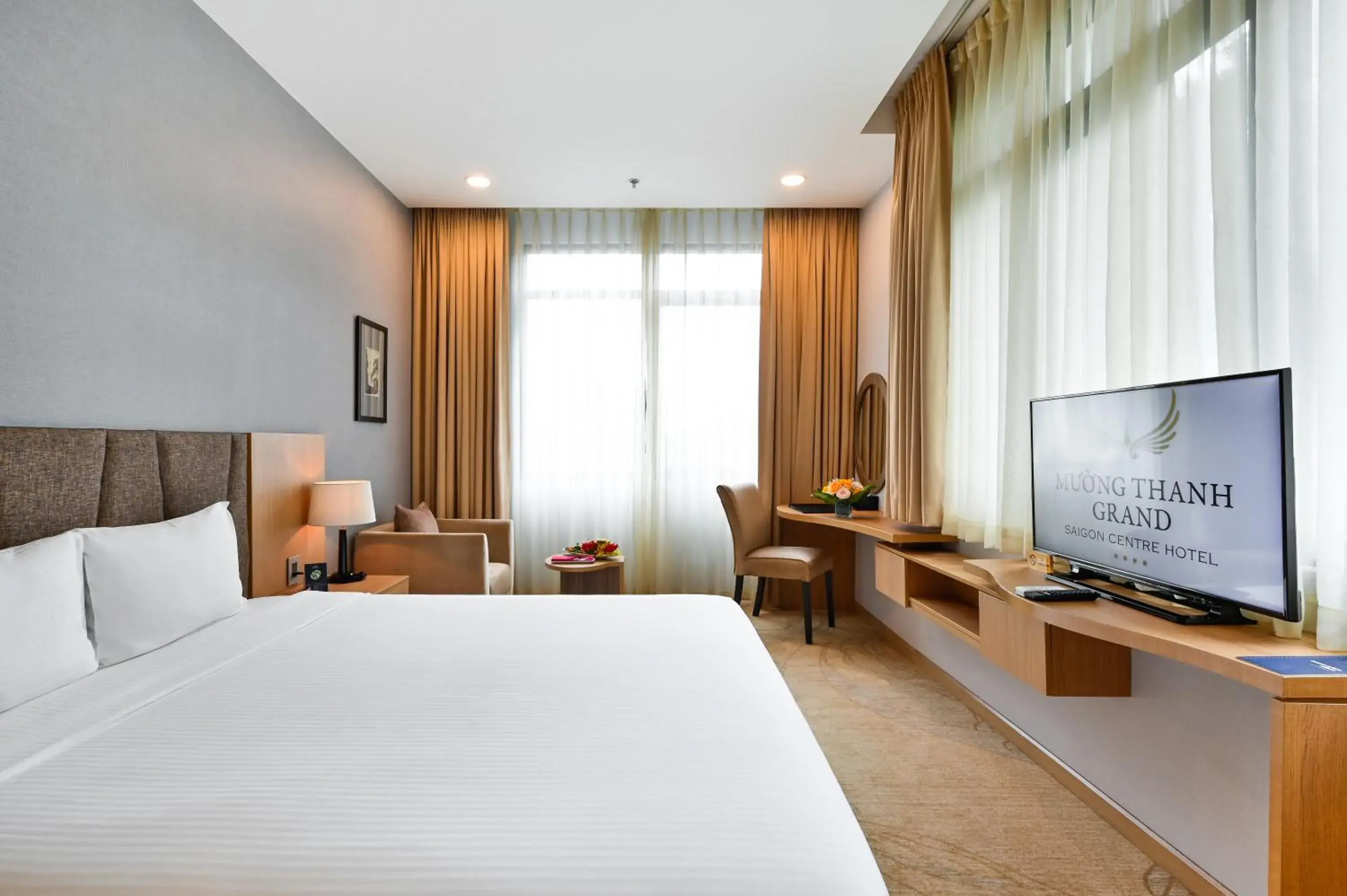 Bed, TV/Entertainment Center in Muong Thanh Grand Saigon Centre Hotel