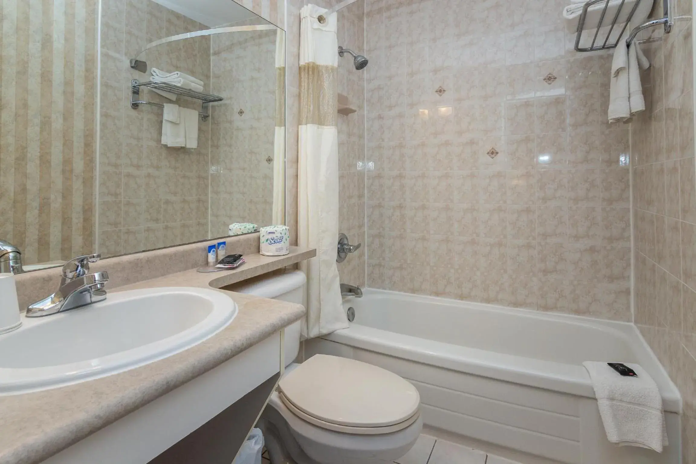 Shower, Bathroom in Canadas Best Value Inn Chinook Station