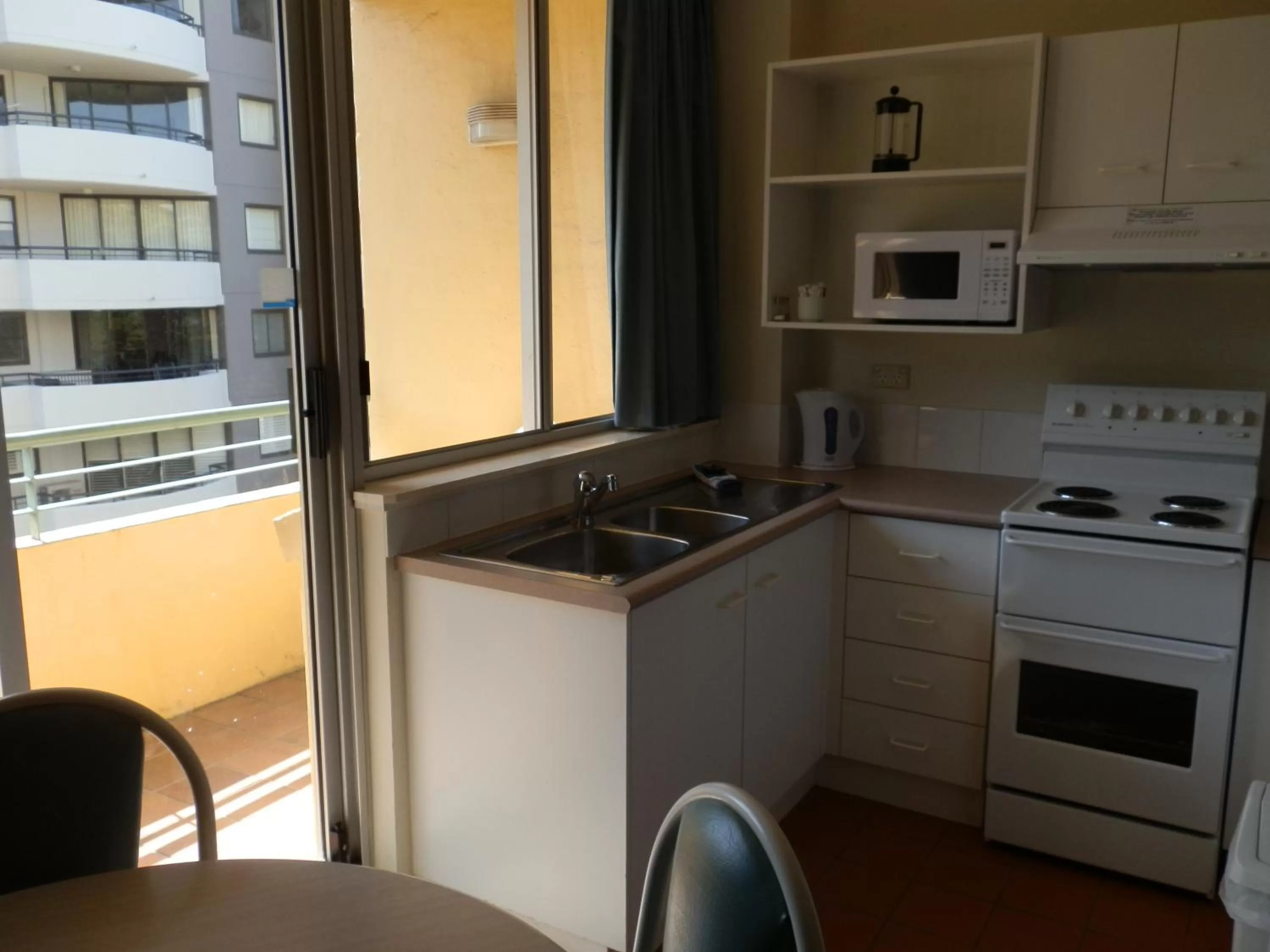 Kitchen or kitchenette in Chasely Apartment Hotel