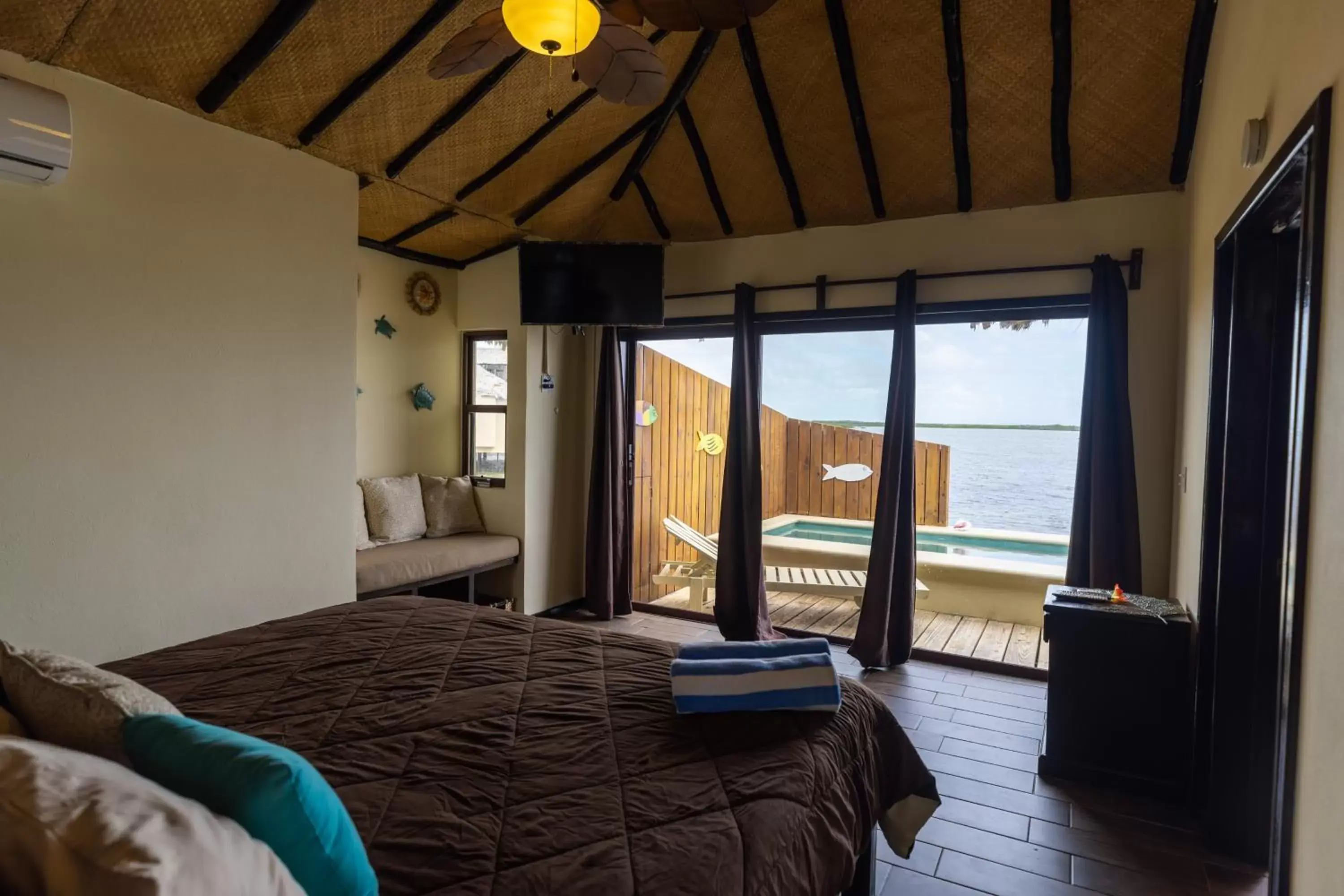 Photo of the whole room, Bed in Lina Point Belize Overwater Resort