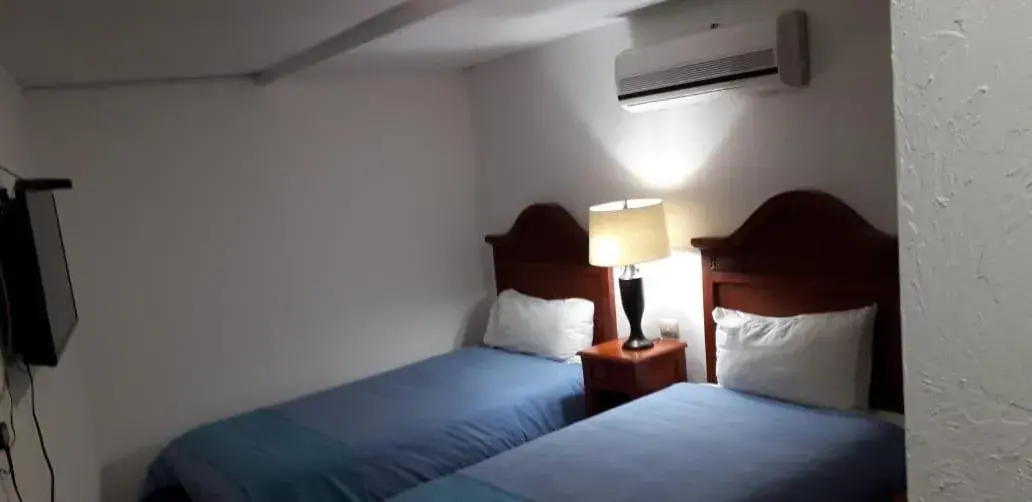 Bed in Hotel Meson del Mar