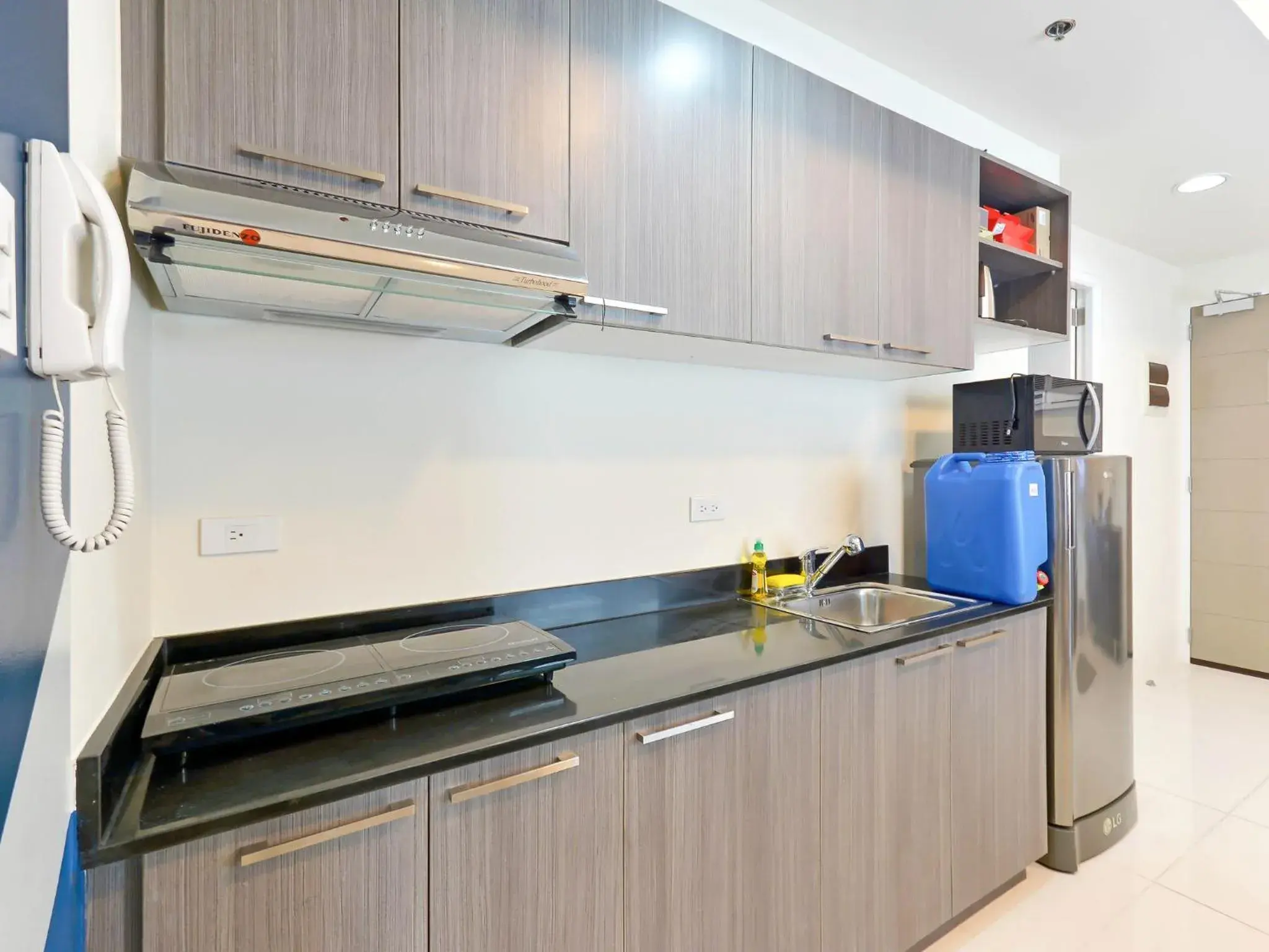 Kitchen or kitchenette, Kitchen/Kitchenette in Currency Serviced Suites