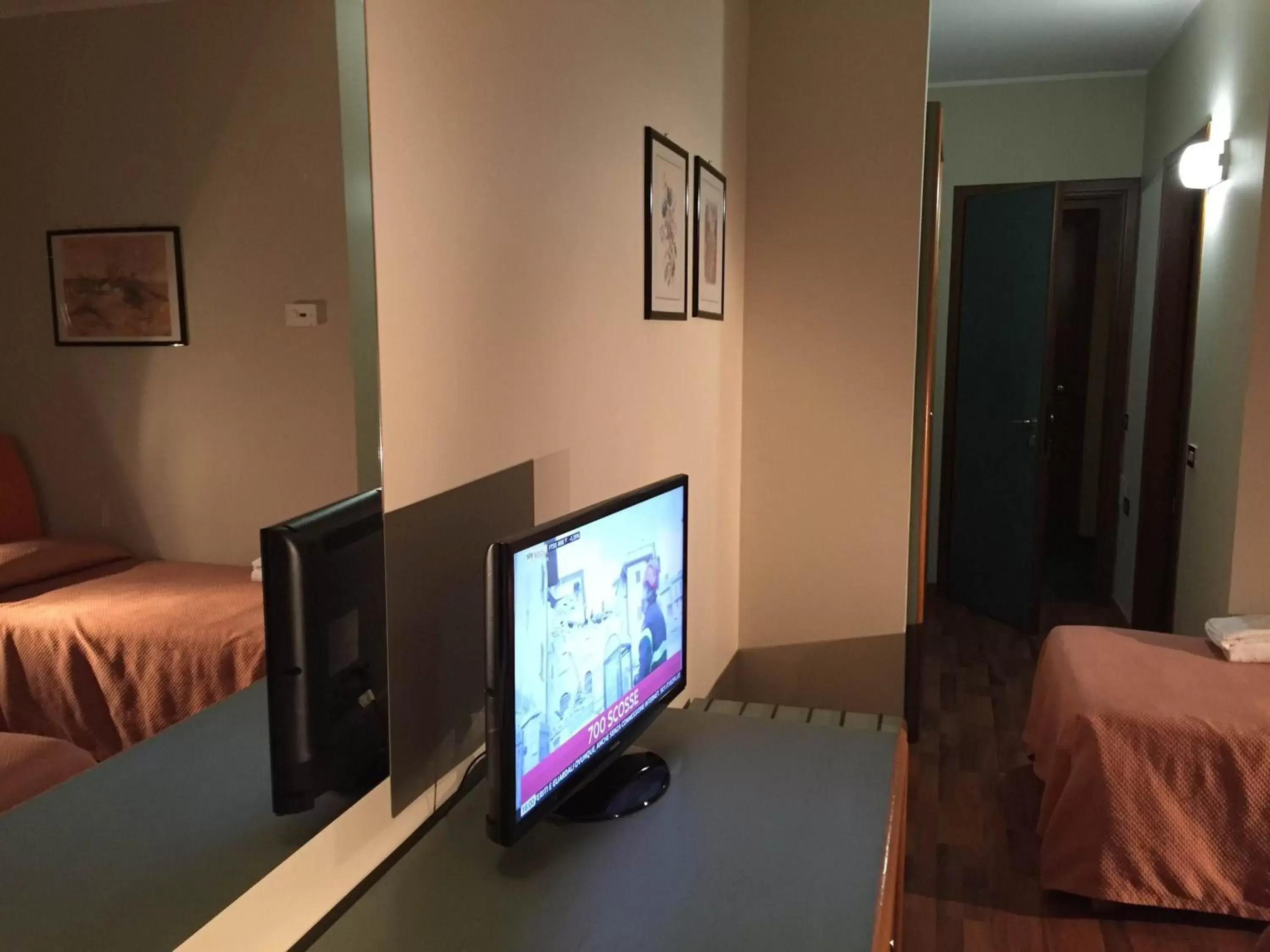 Photo of the whole room, TV/Entertainment Center in Orzihotel