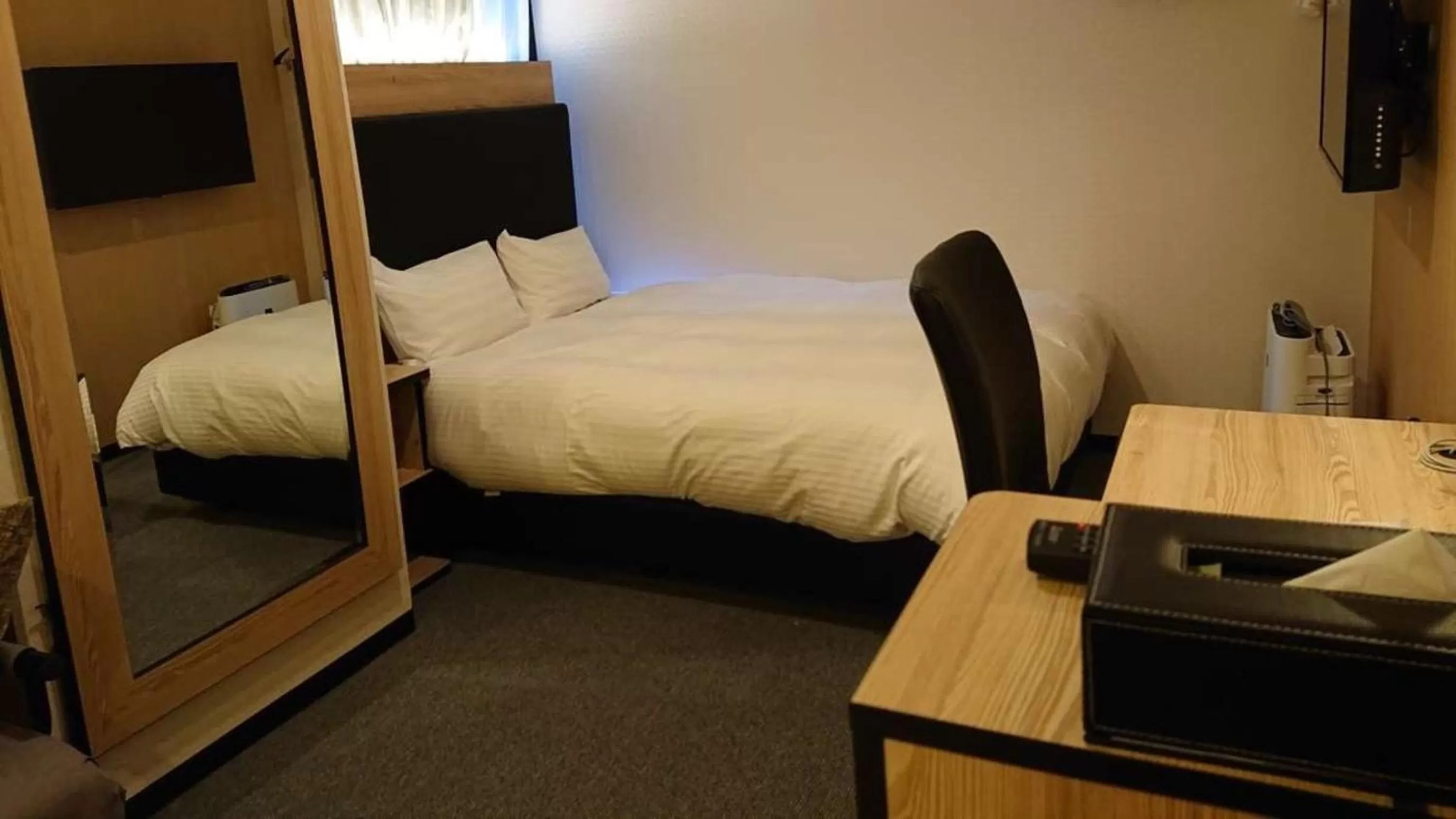 Bed in Green Rich Hotel Kurume Natural Hot Spring Arimamutsumonnoyu