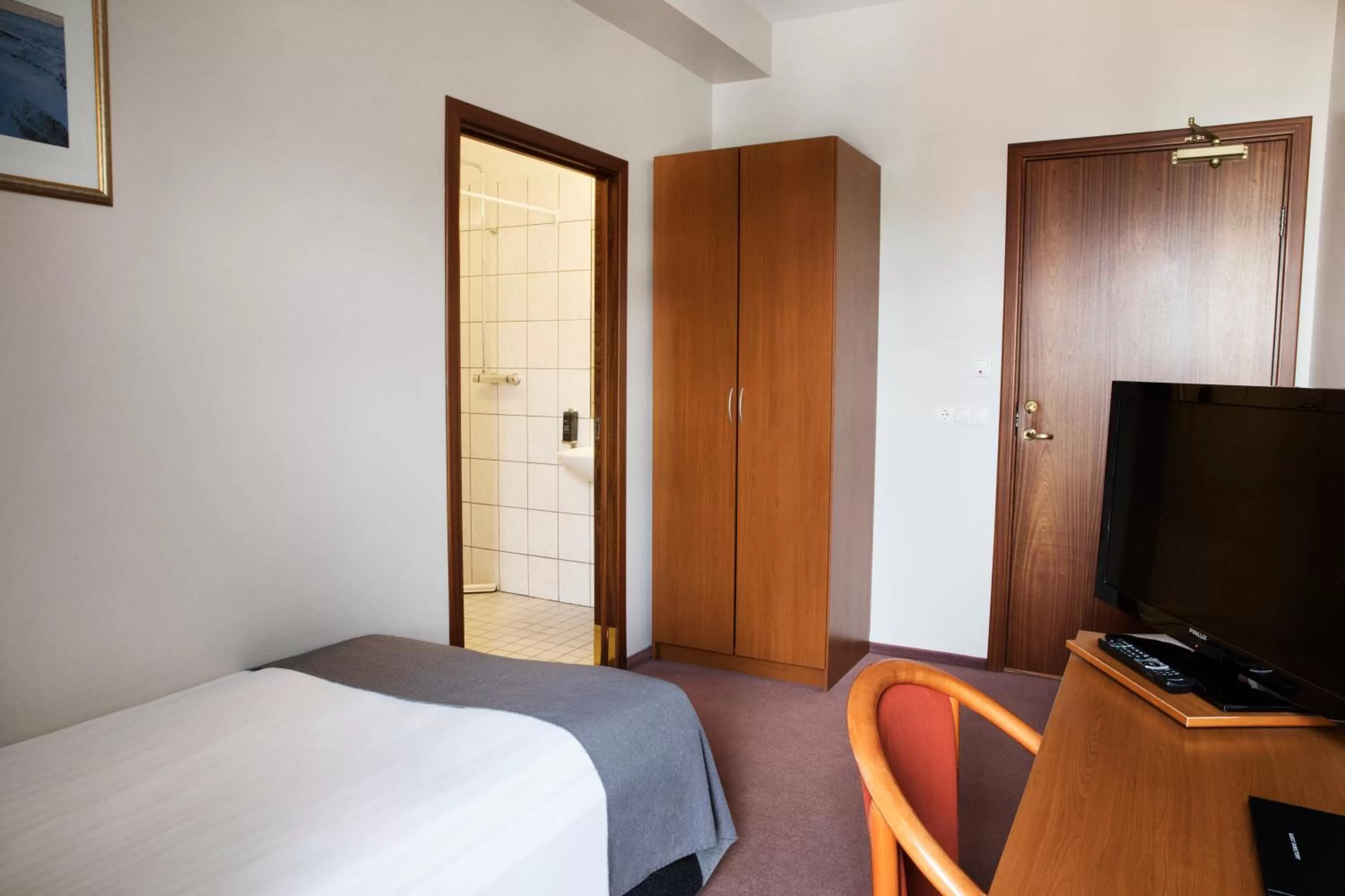 Bedroom, Bed in Fosshotel Baron