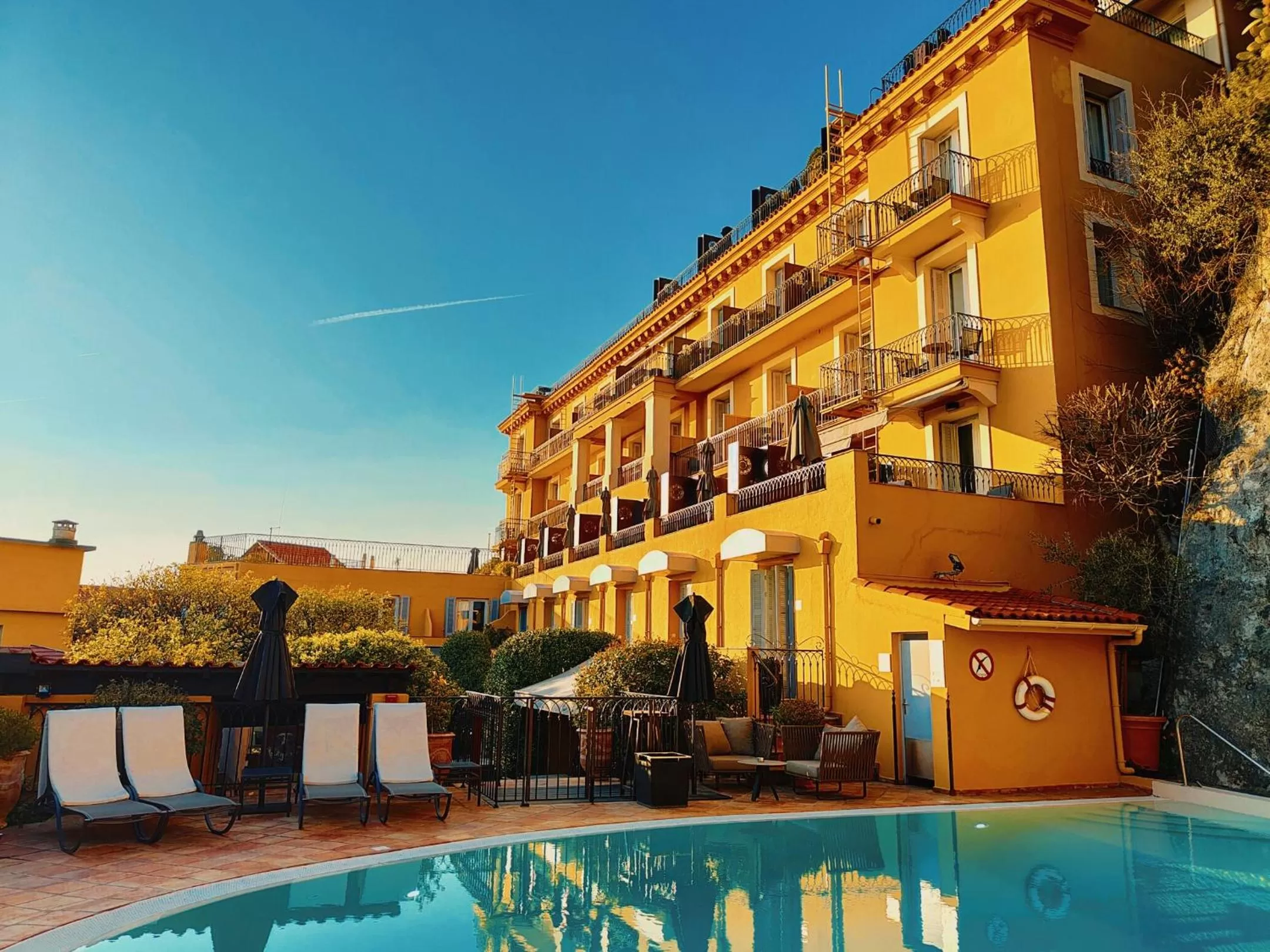 Swimming pool in Hôtel La Pérouse Nice Baie des Anges
