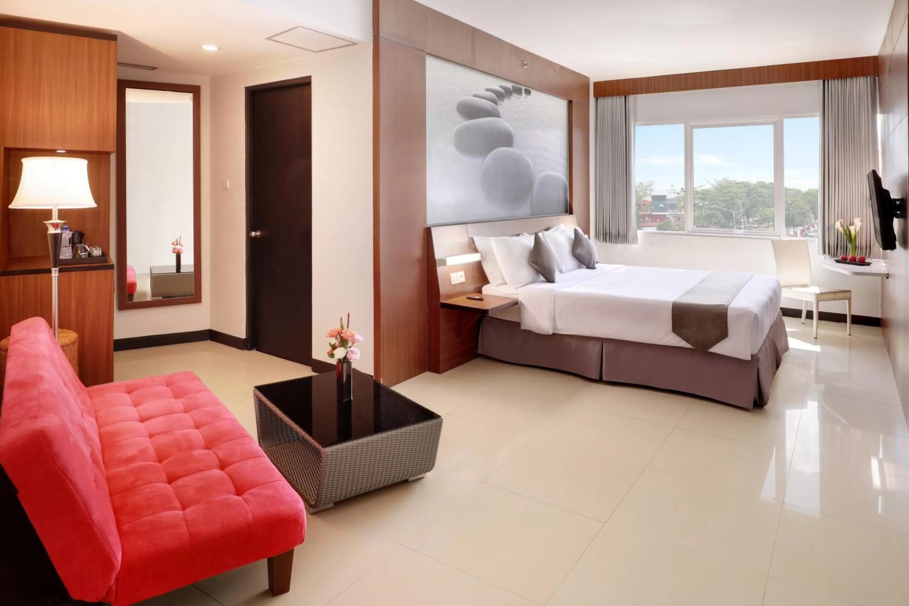 Photo of the whole room, Bed in Hotel Neo Palma Palangkaraya by ASTON