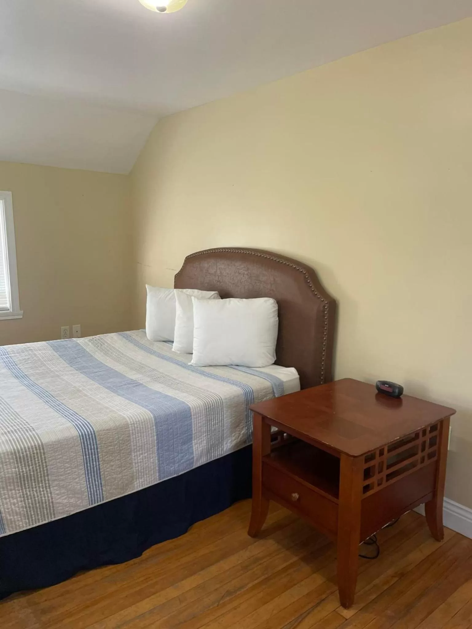 Bed in The Grand Beach Inn