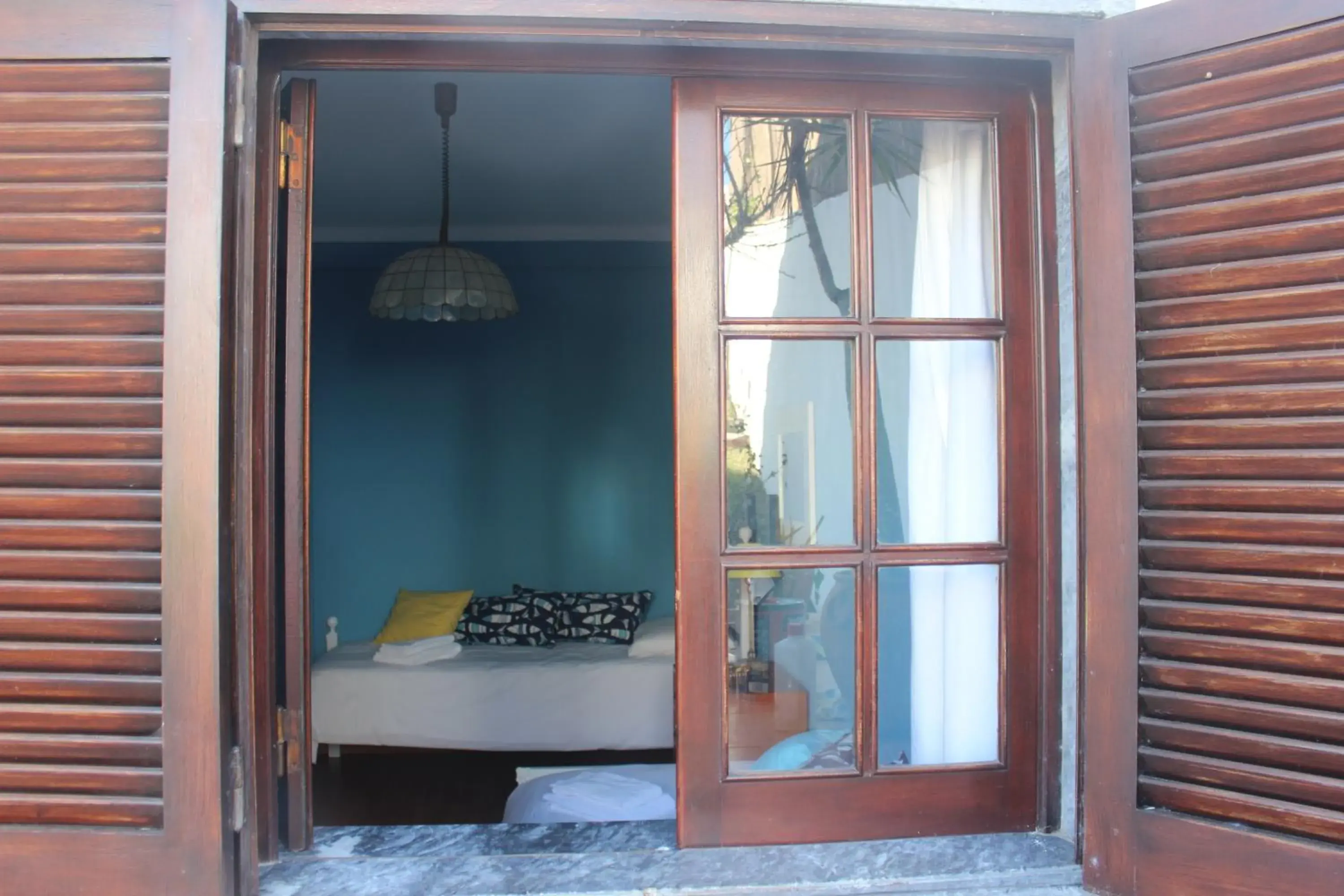 Photo of the whole room in Ericeira Chill Hill Hostel & Private Rooms - Peach Garden