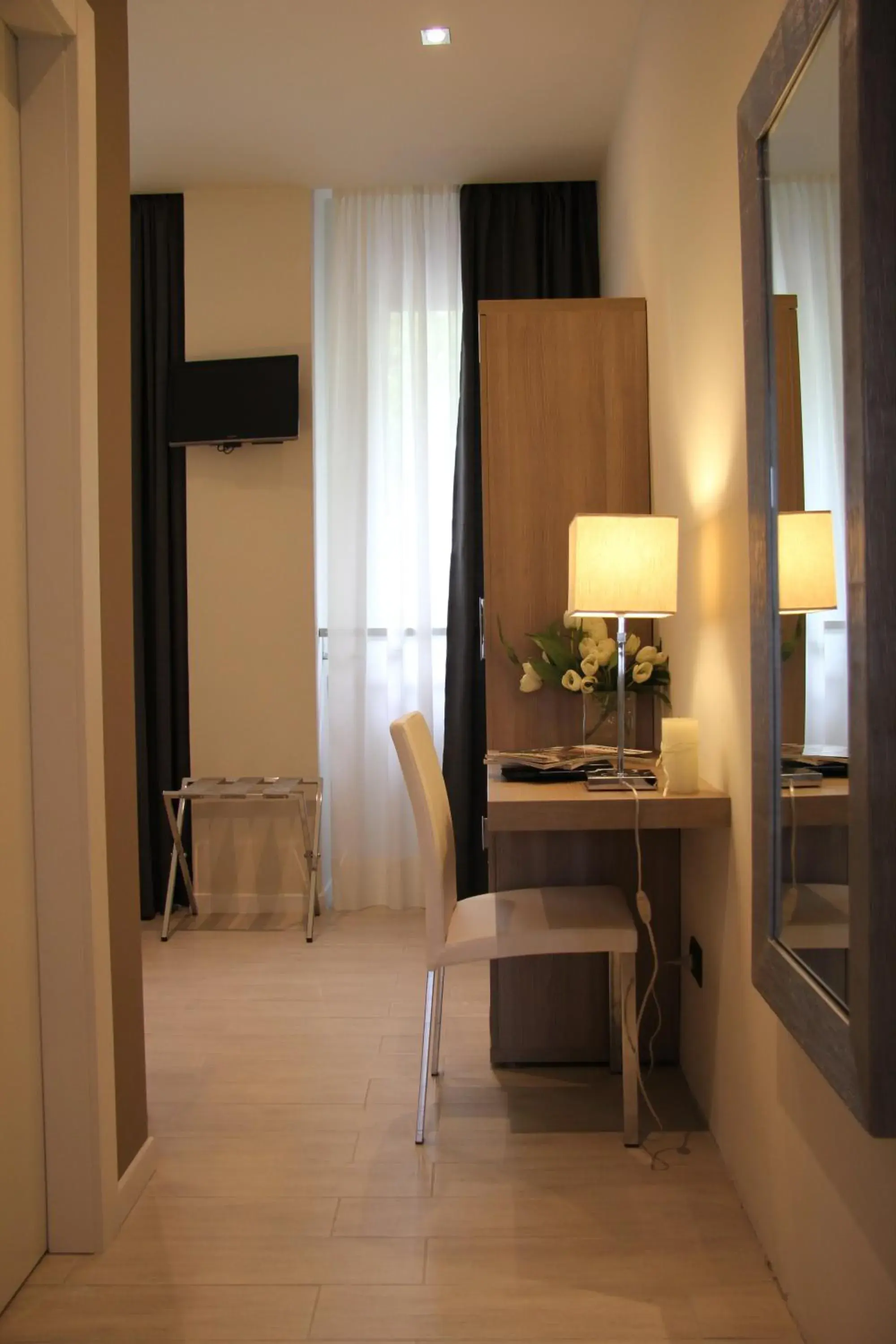 Photo of the whole room, TV/Entertainment Center in Hotel Zara Milano
