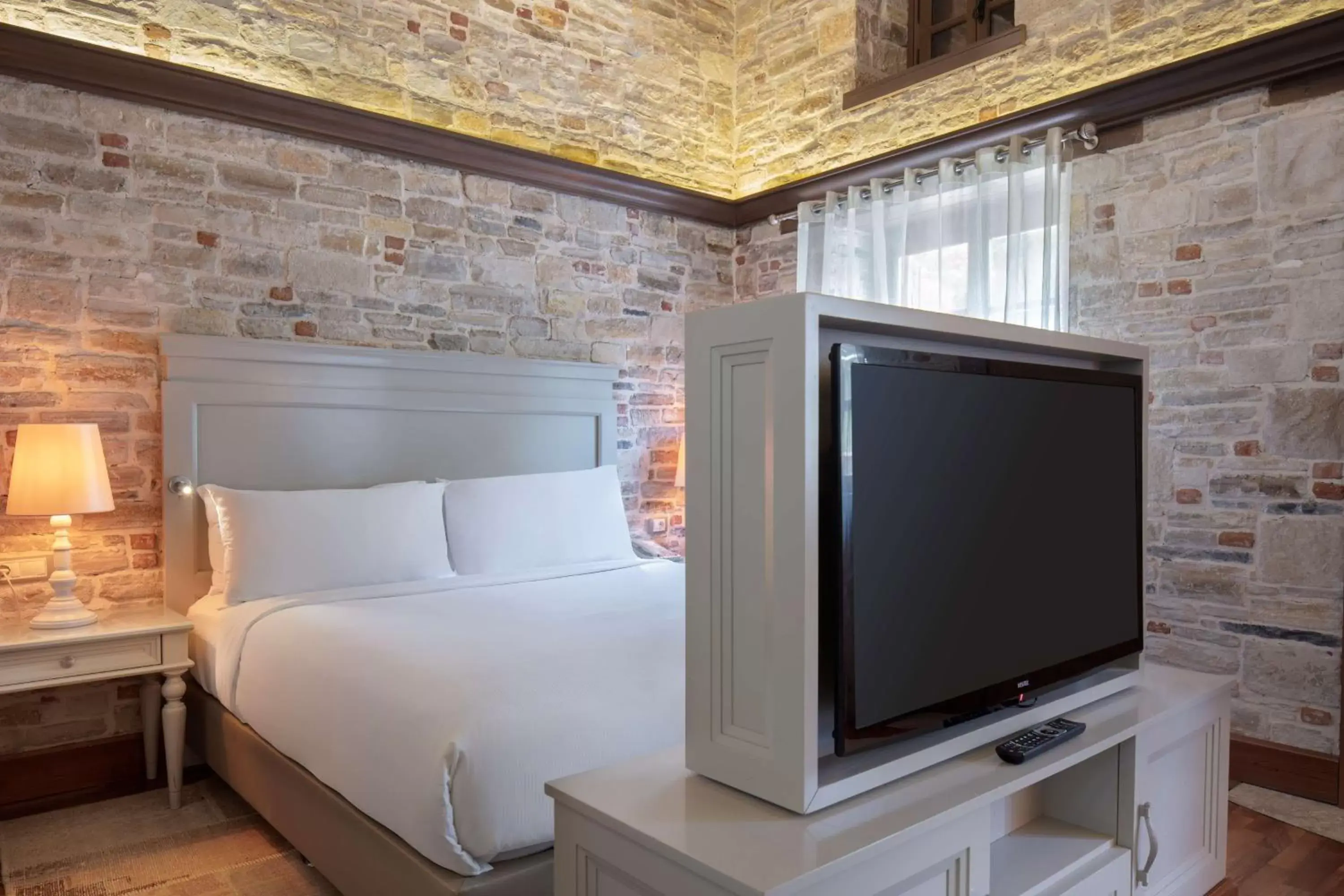 Bed, TV/Entertainment Center in DoubleTree by Hilton Kusadasi