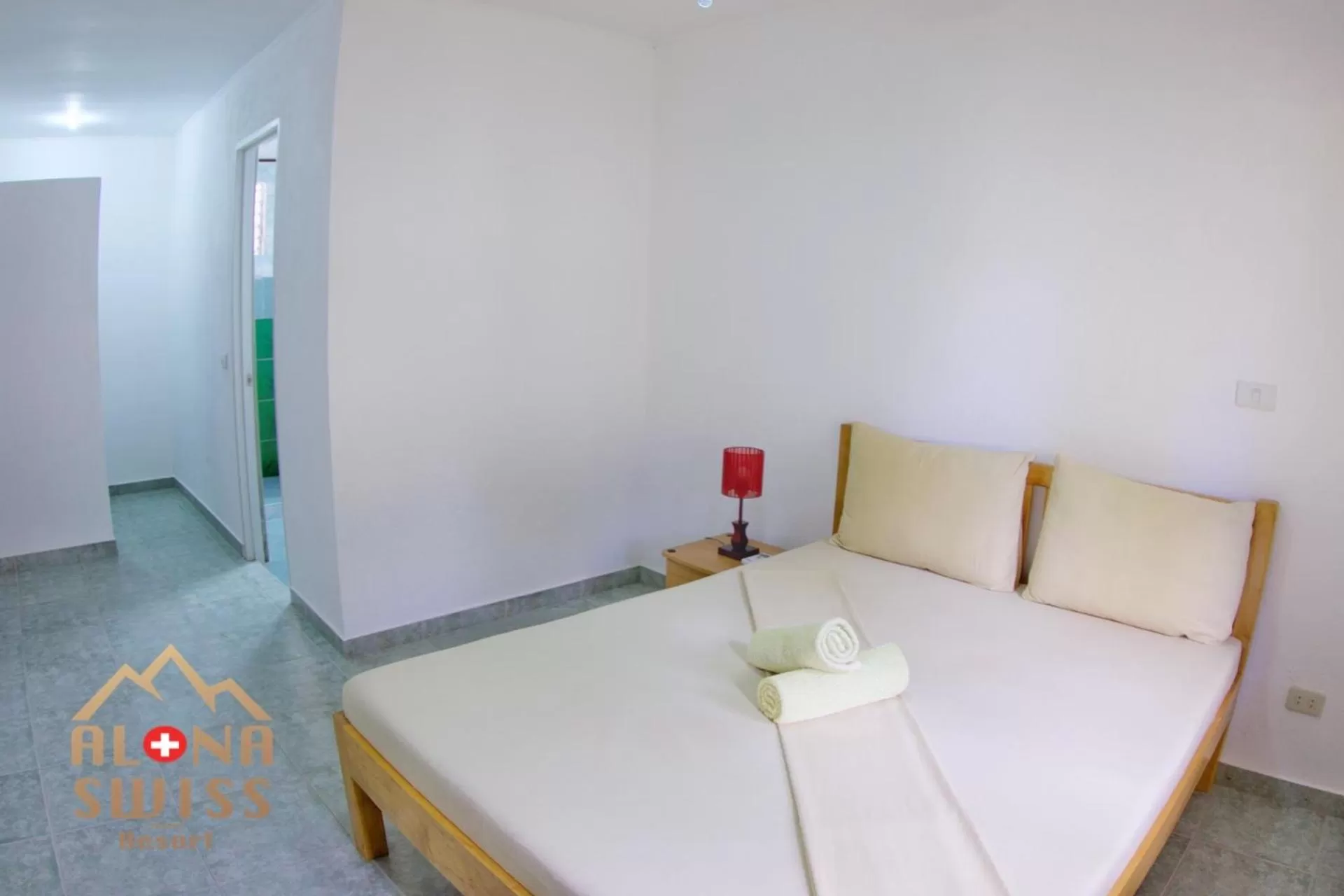 Bed in Alona Swiss Resort