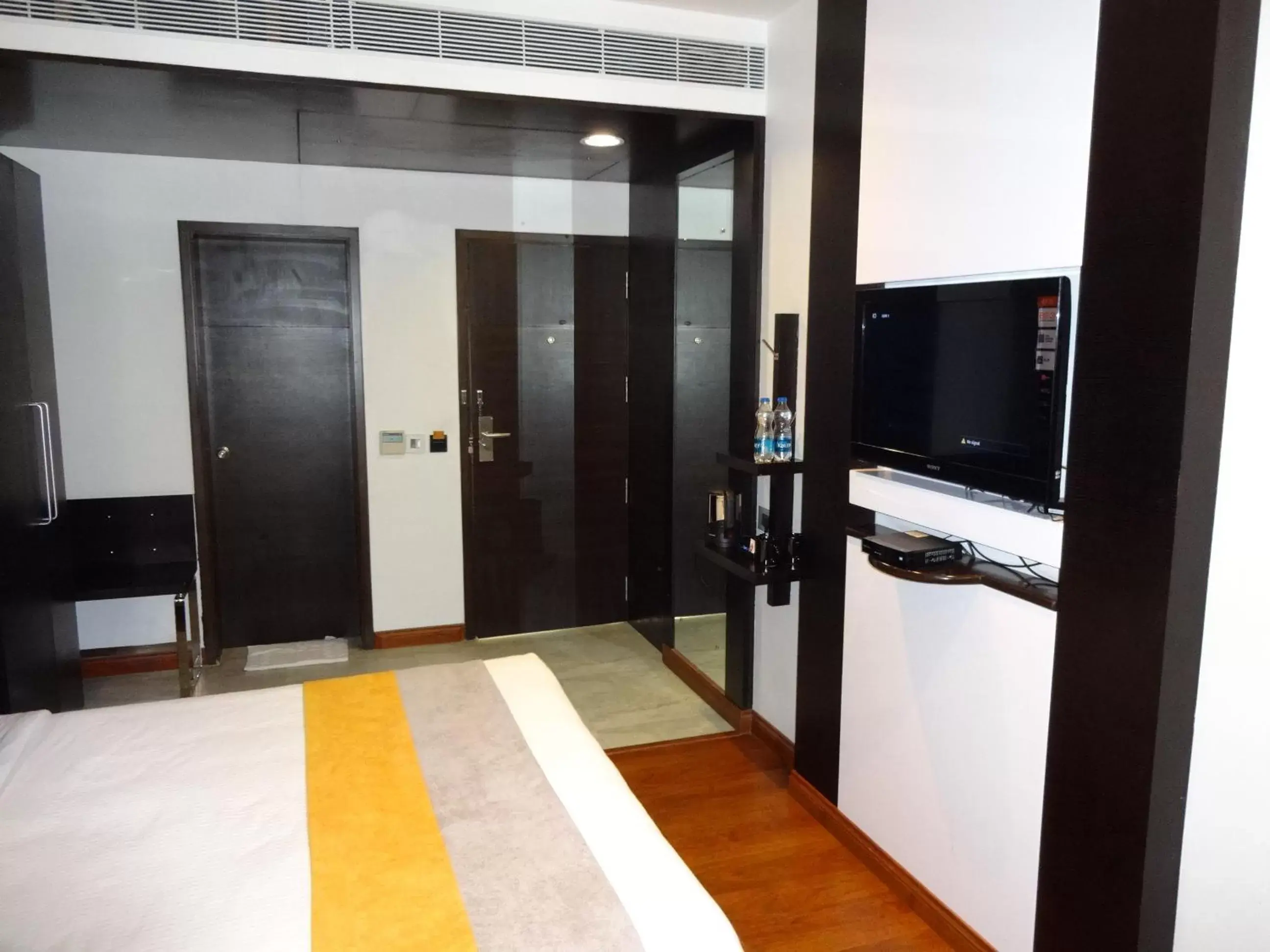 Bedroom, TV/Entertainment Center in Astoria Hotels Madurai