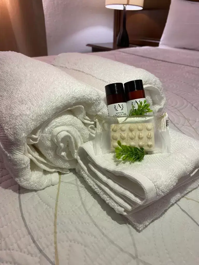 towels, Bed in Cabo Tortuga Hotel Boutique