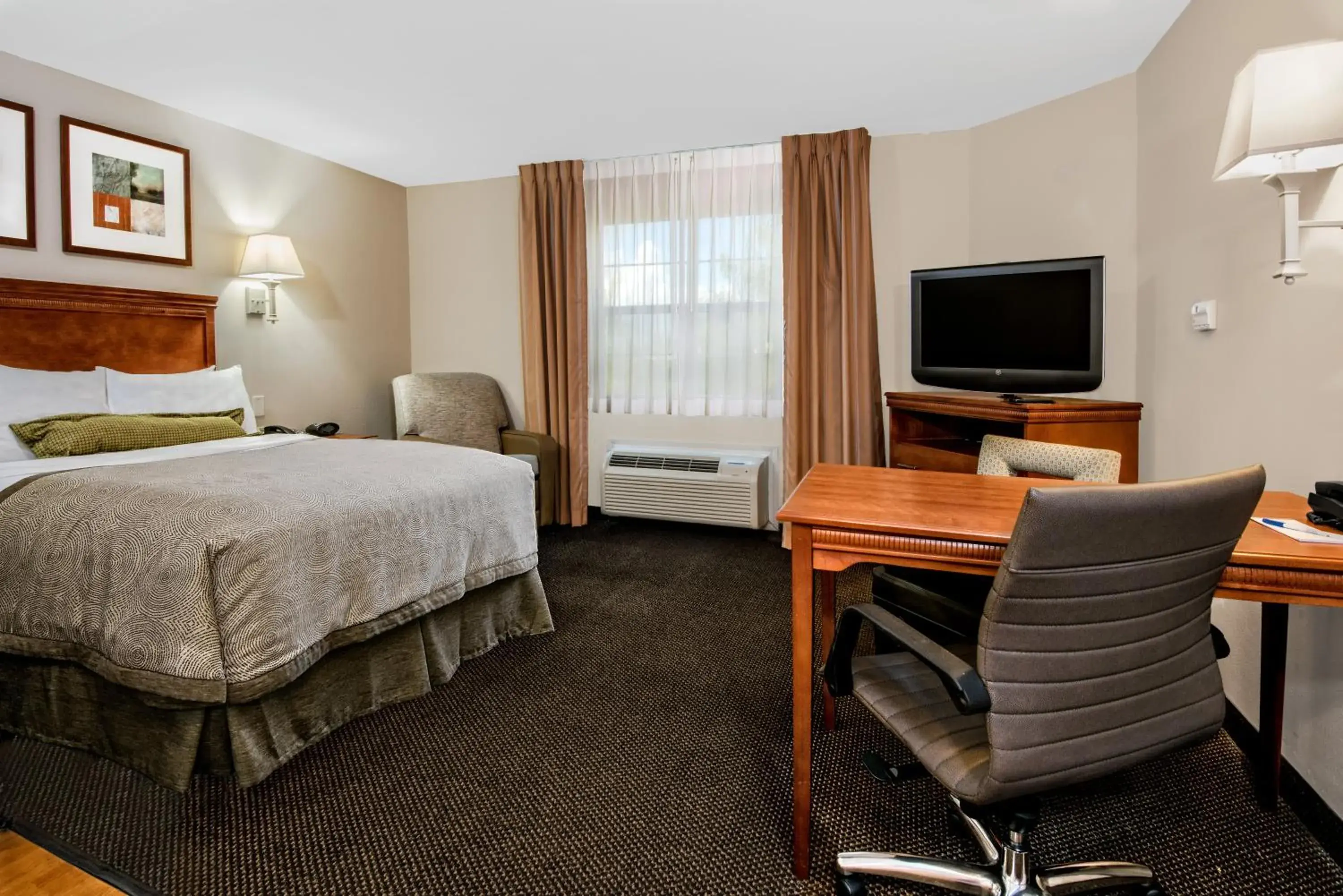 Photo of the whole room, TV/Entertainment Center in Candlewood Suites Galveston