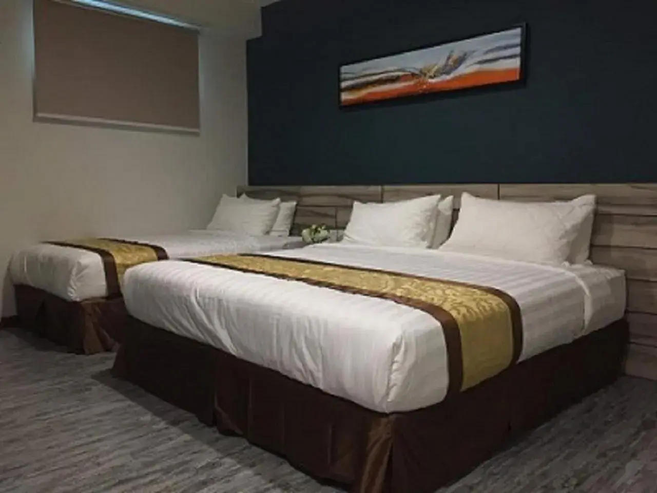 Bed in Meriton Inn Hotel