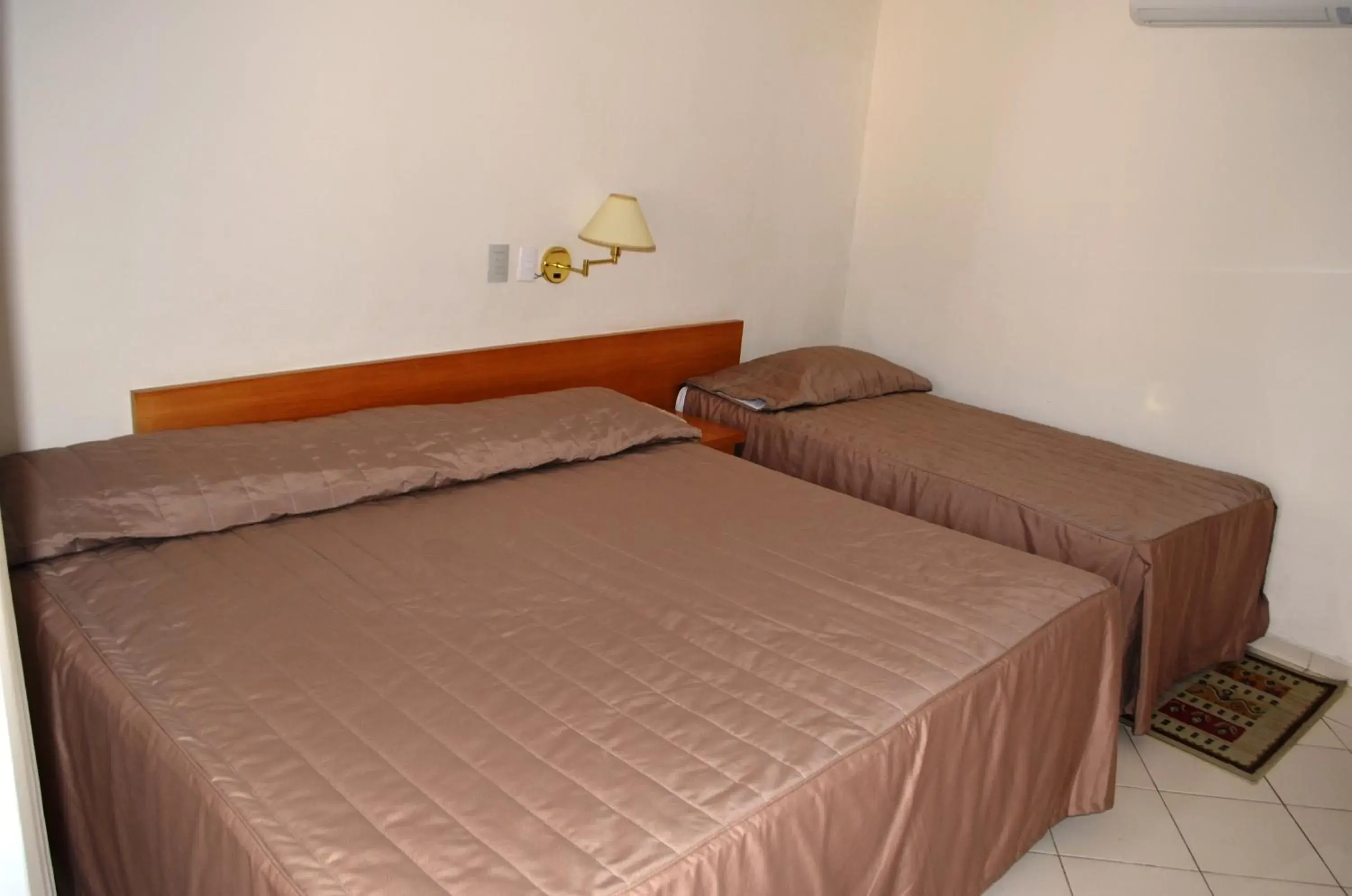 Bed in Hotel São Luiz