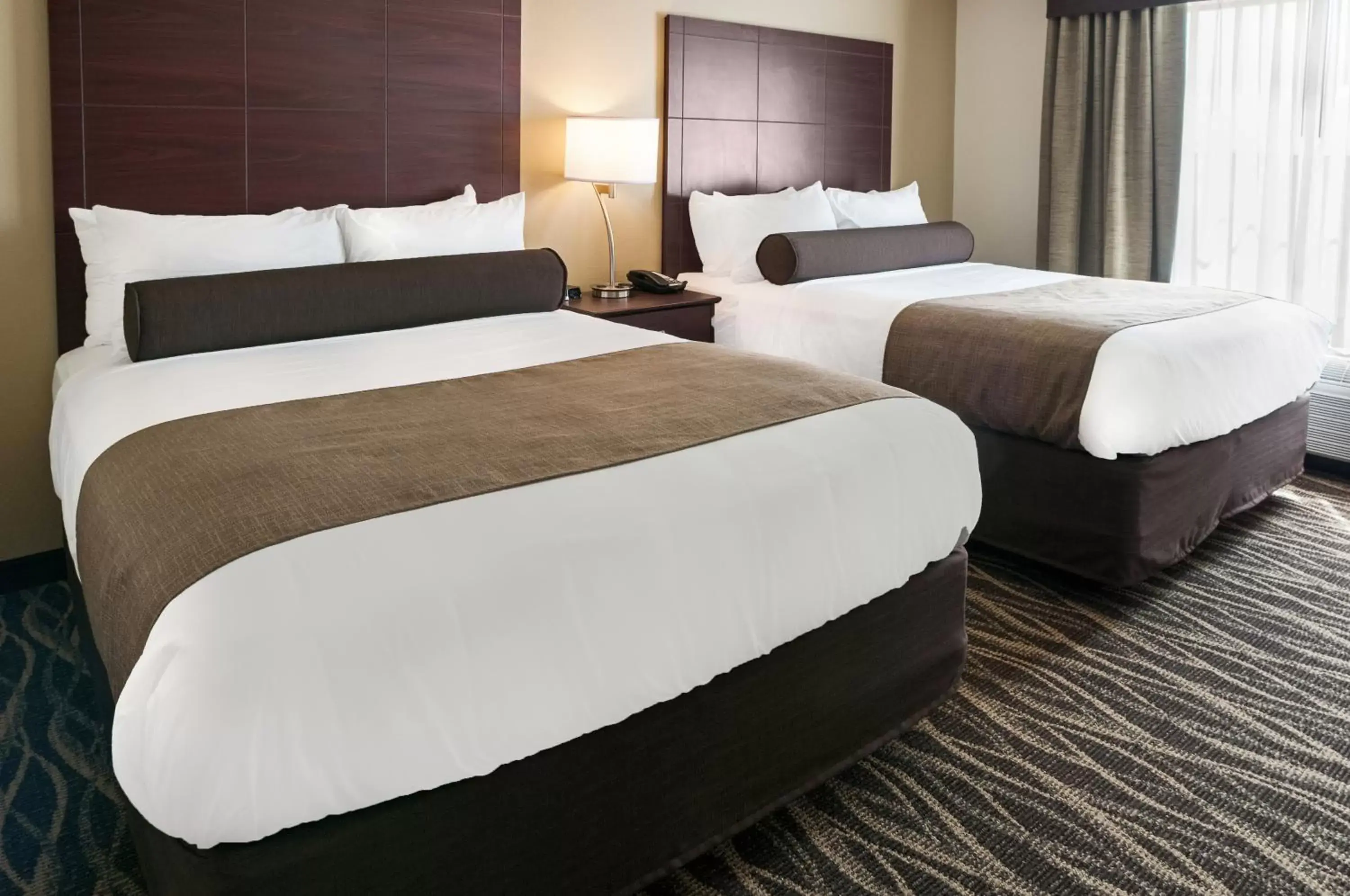 Bed in Cobblestone Hotel & Suites Appleton International Airport