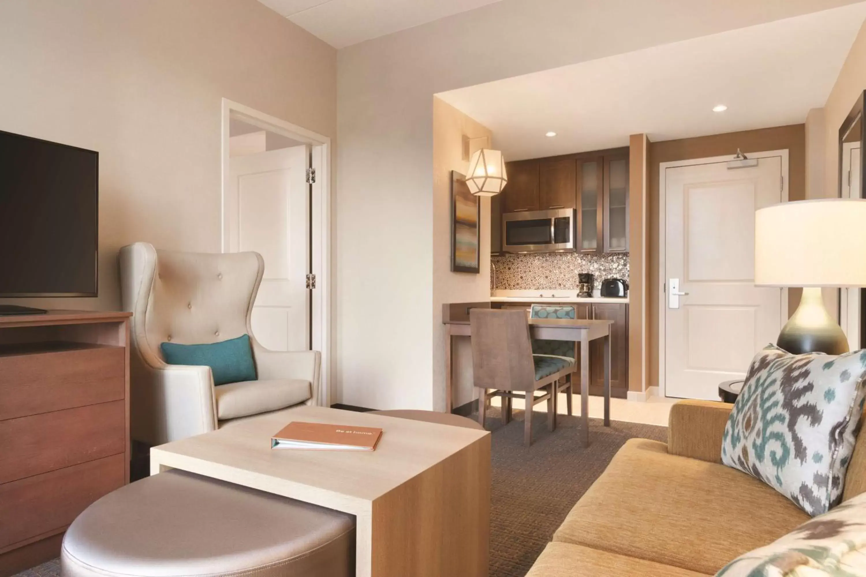Living room, Kitchen/Kitchenette in Homewood Suites by Hilton Calgary Downtown
