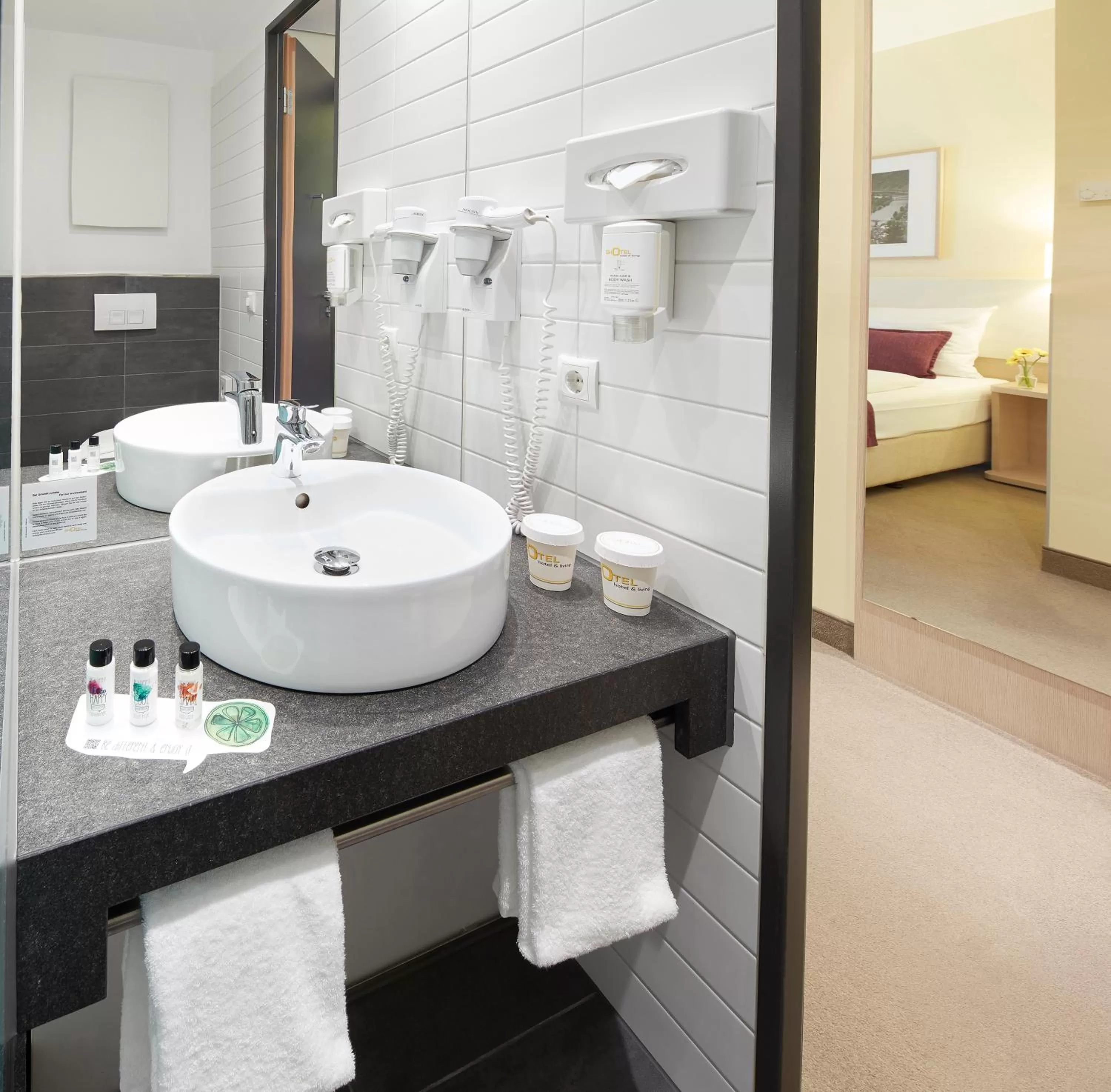 Bathroom, Bed in GHOTEL hotel & living Koblenz