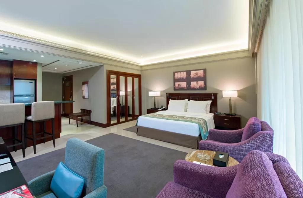 Bed in Somewhere Hotel Apartment