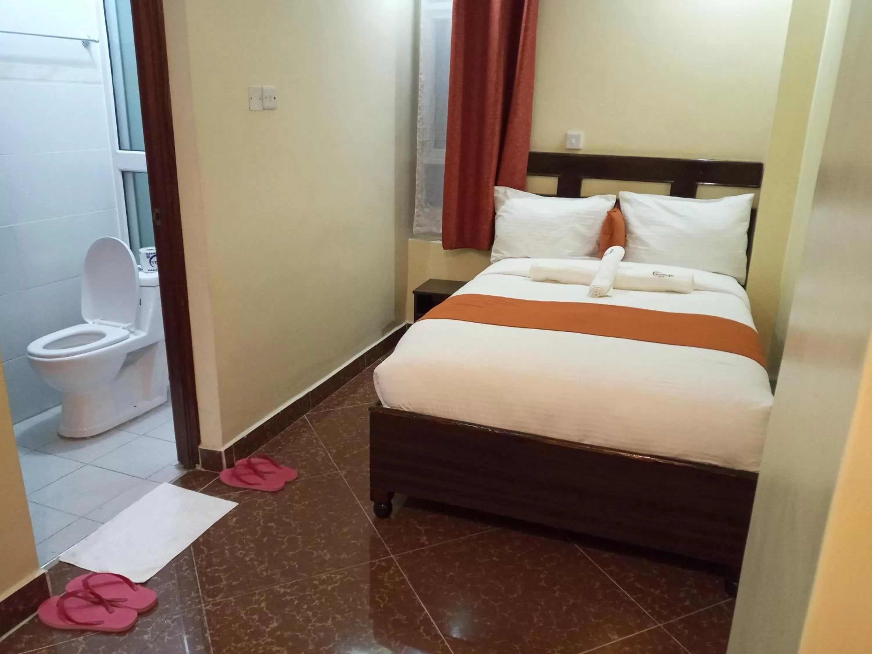 Bed in Claire de Lune Moonlight Hotel