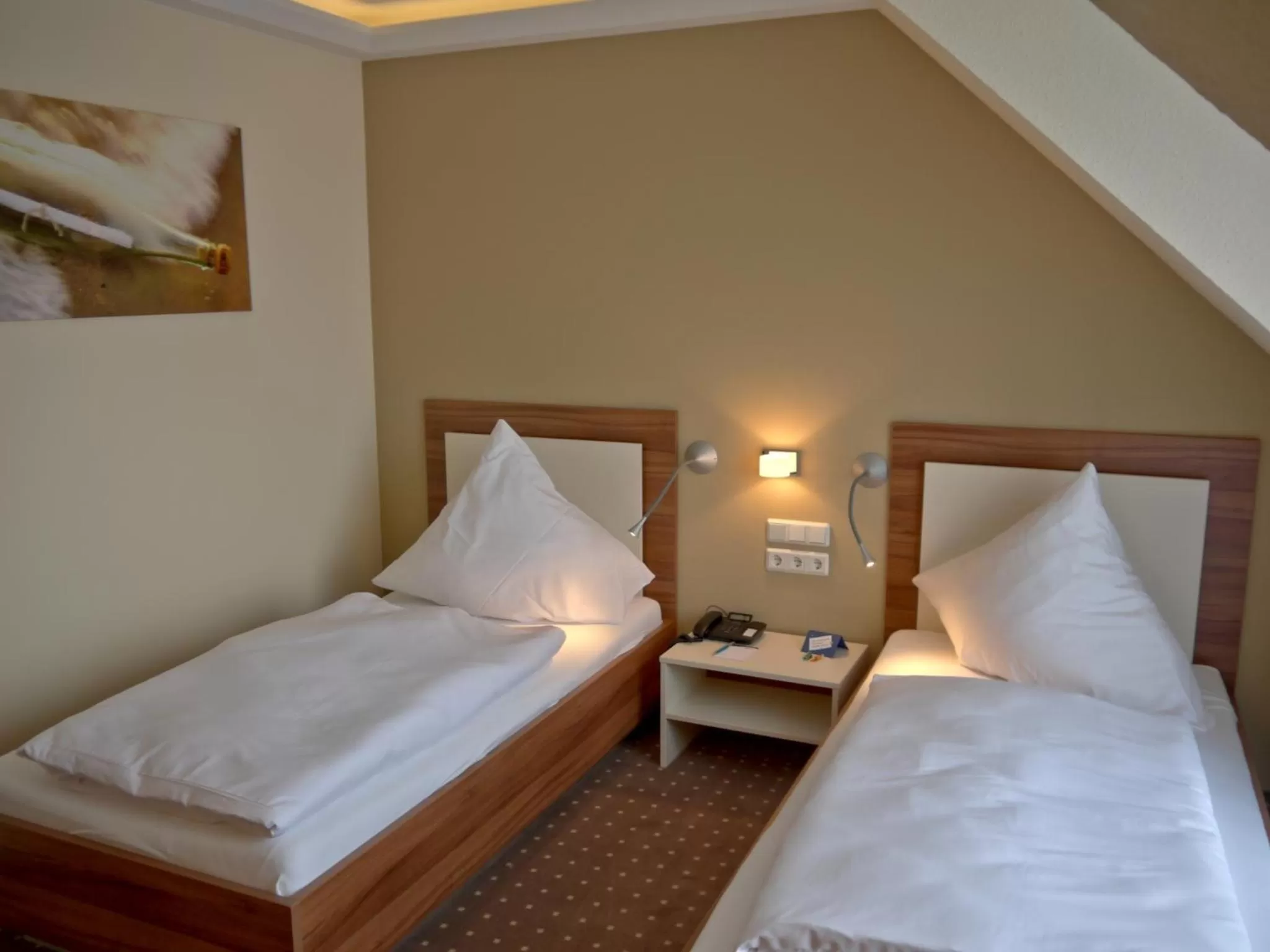 Bed in Hotel Friesische Wehde