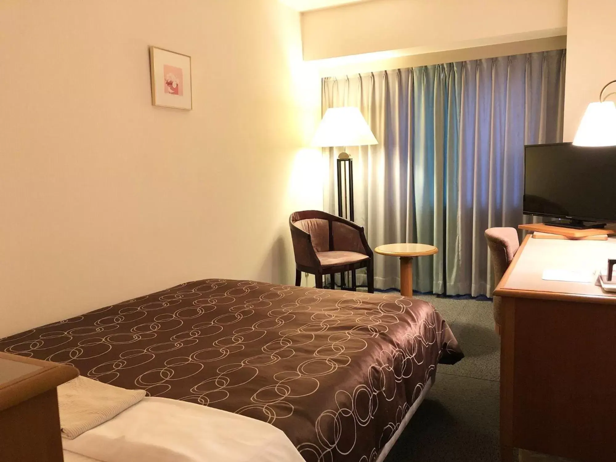 Bed in Hotel Sunroute Niigata