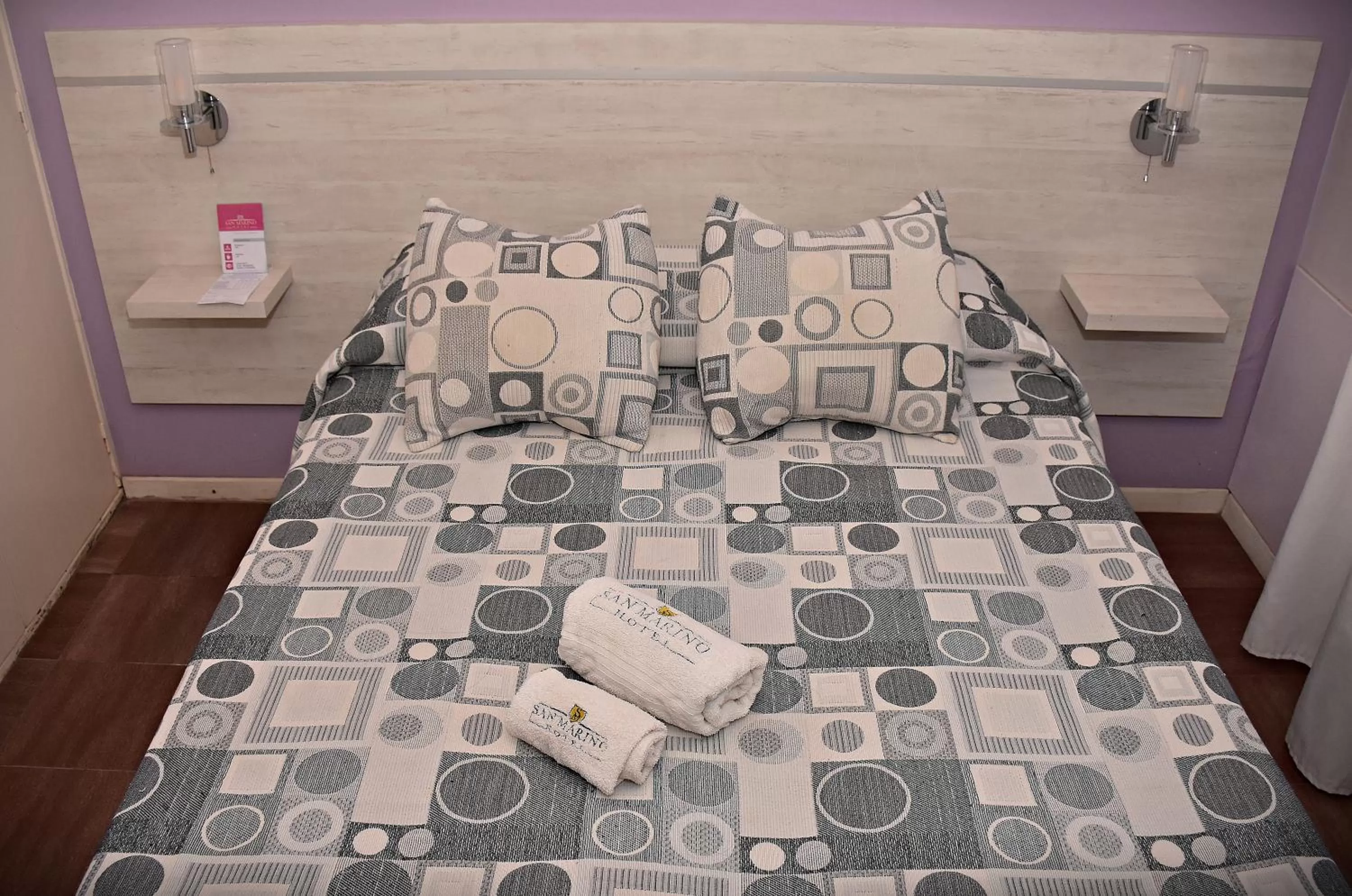 Bed in Hotel San Marino