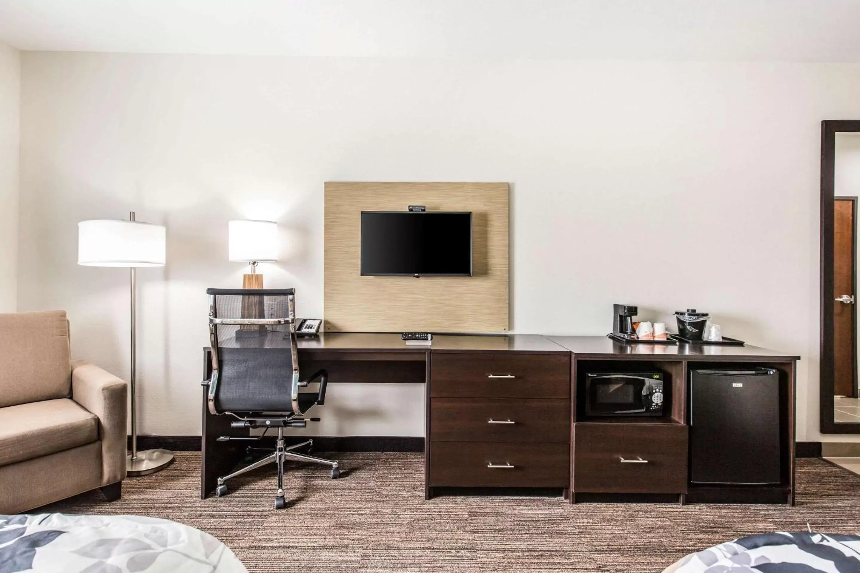 Photo of the whole room, TV/Entertainment Center in Sleep Inn & Suites - Bryan