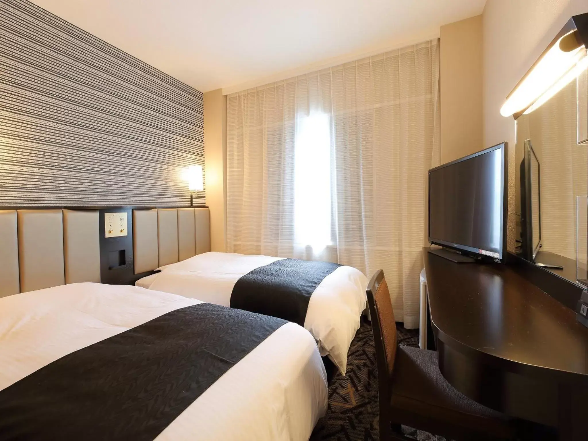 Bed in APA Hotel Takaoka-Marunouchi