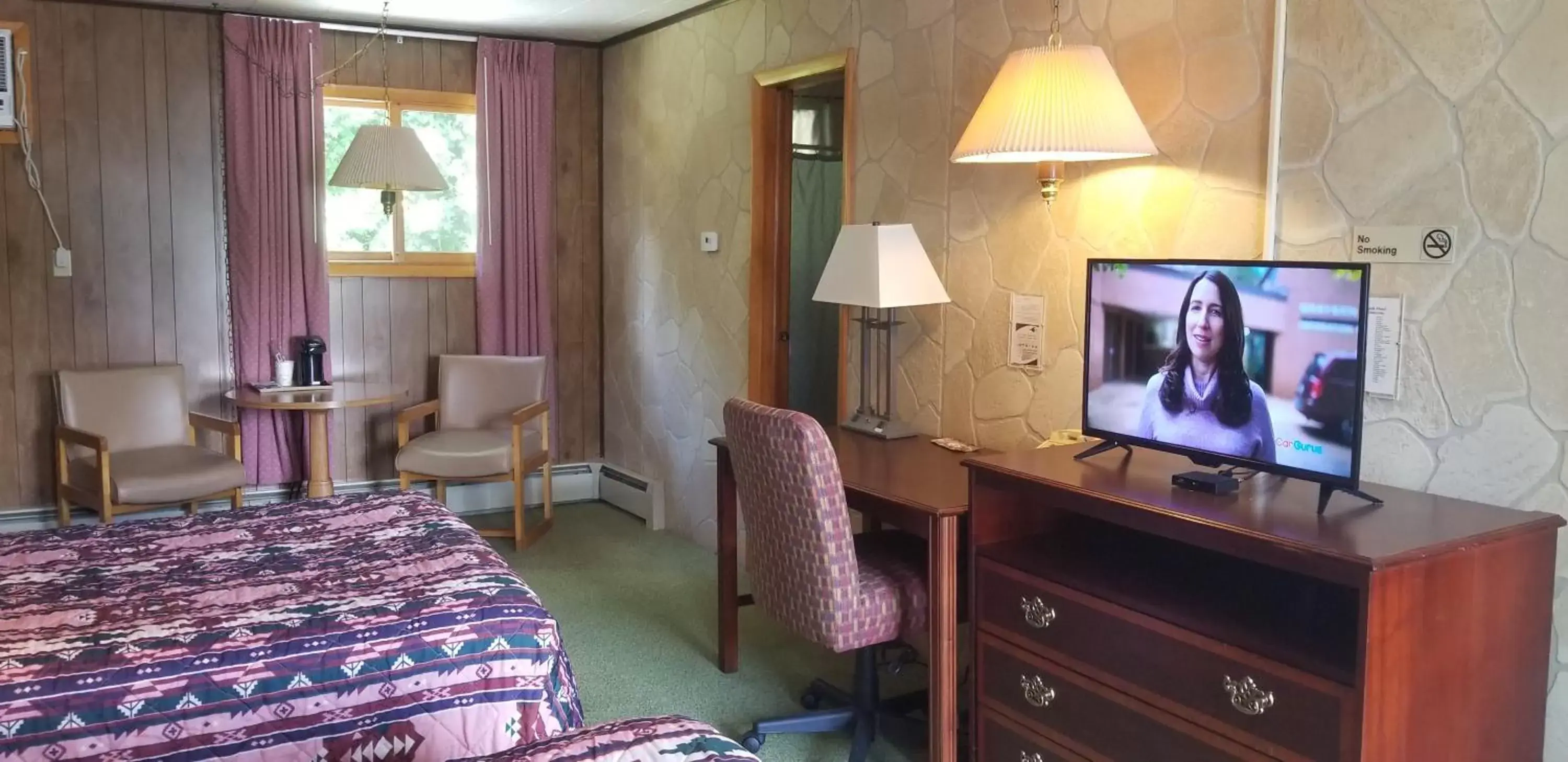 Photo of the whole room, TV/Entertainment Center in Red Ranch Inn
