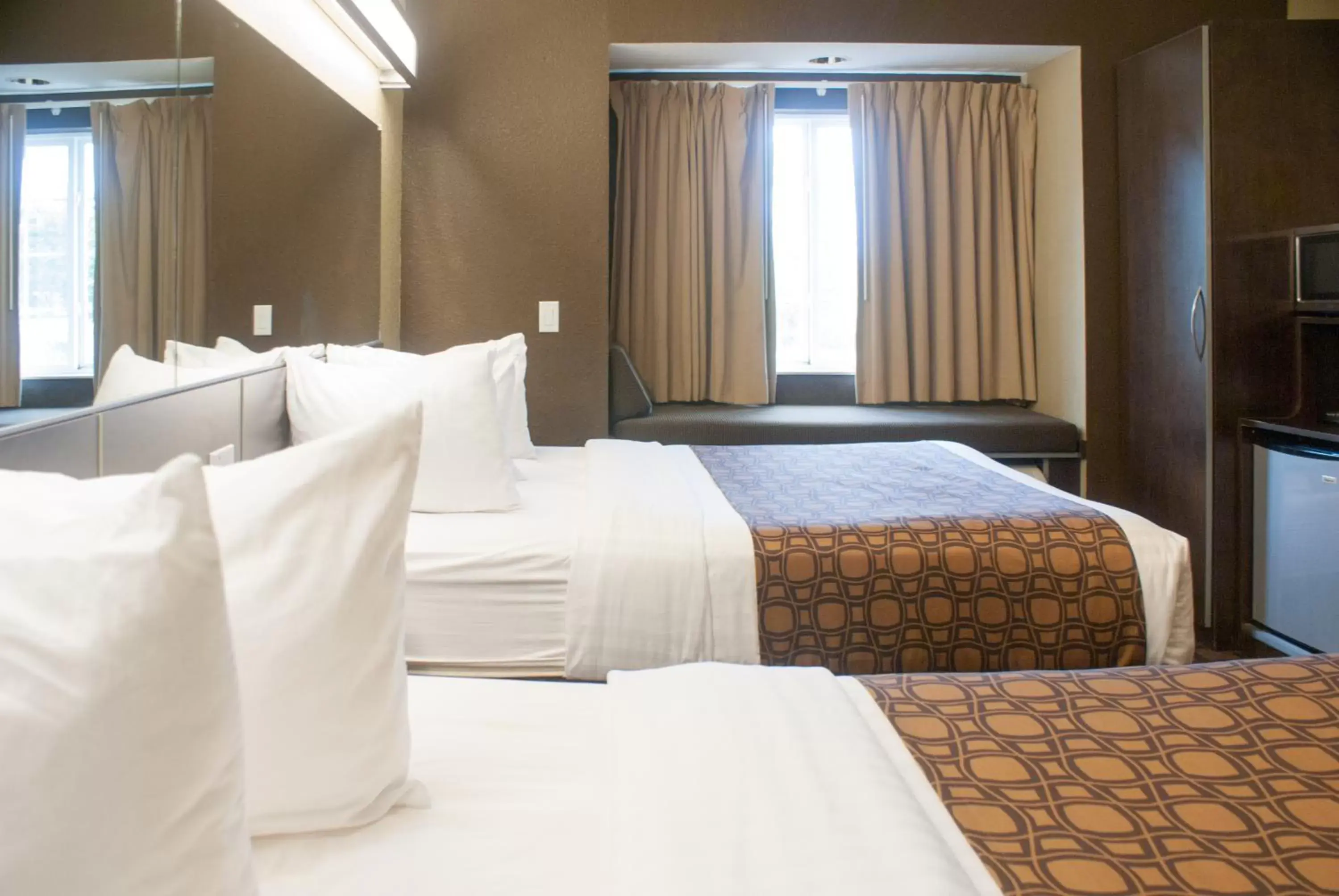 Bed in Microtel Inn & Suites by Wyndham Jacksonville Airport