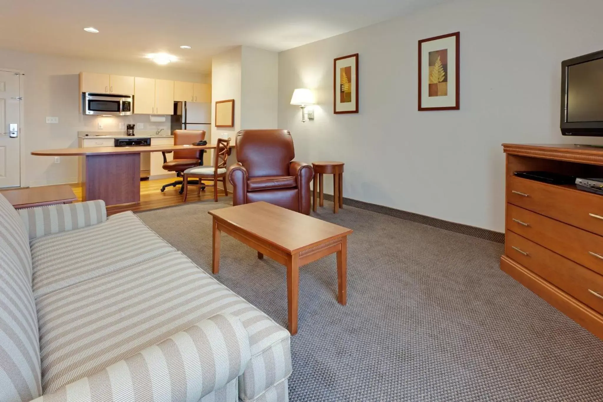 Photo of the whole room, Seating Area in Candlewood Suites Watertown Fort Drum, an IHG Hotel