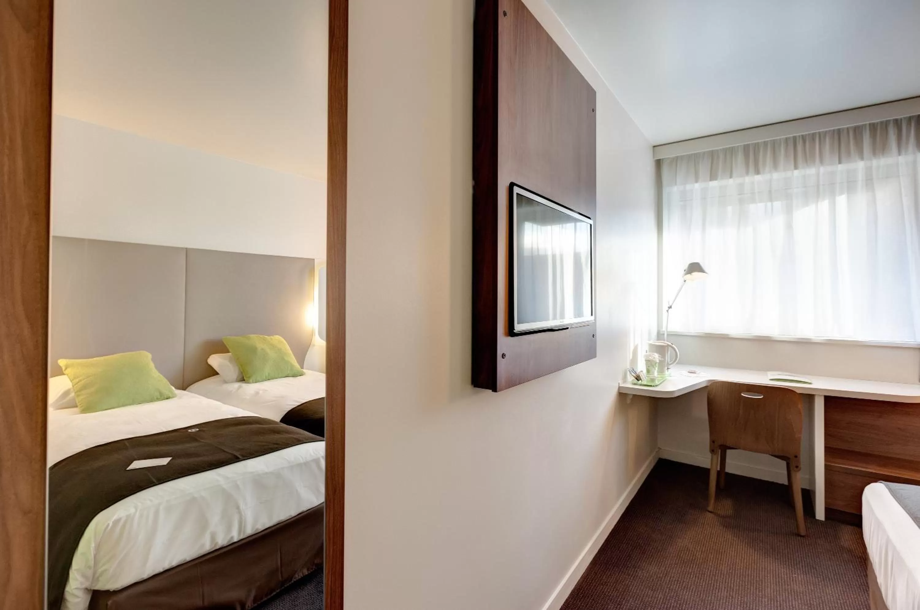 Photo of the whole room, Bed in Campanile La Roche Sur Yon Centre Gare