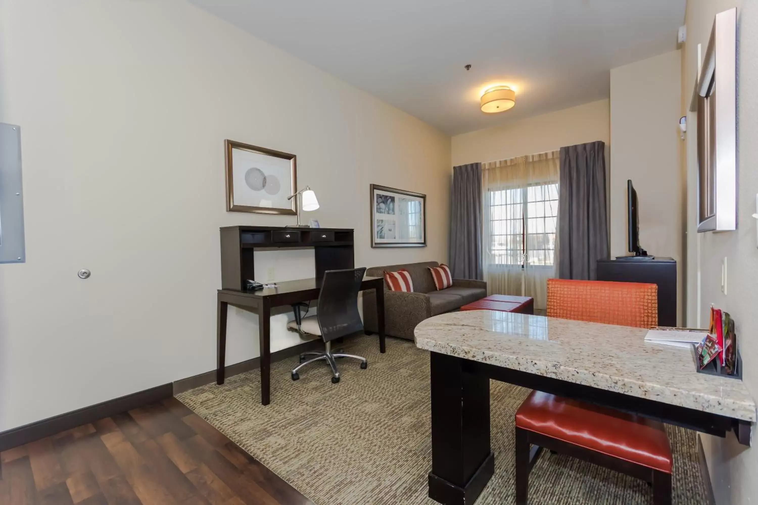 Photo of the whole room, Dining Area in Staybridge Suites Grand Forks, an IHG Hotel