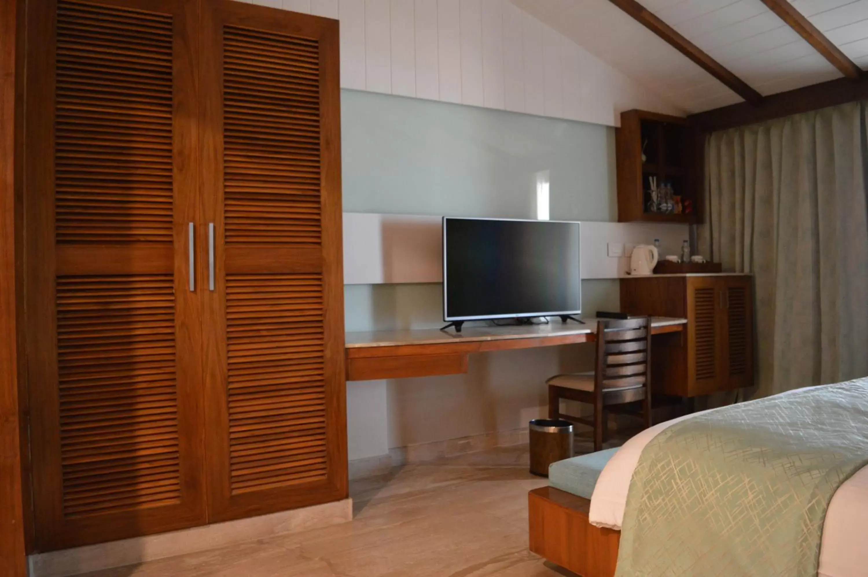 Bed, TV/Entertainment Center in Welcomhotel by ITC Hotels, Kences Palm Beach, Mamallapuram