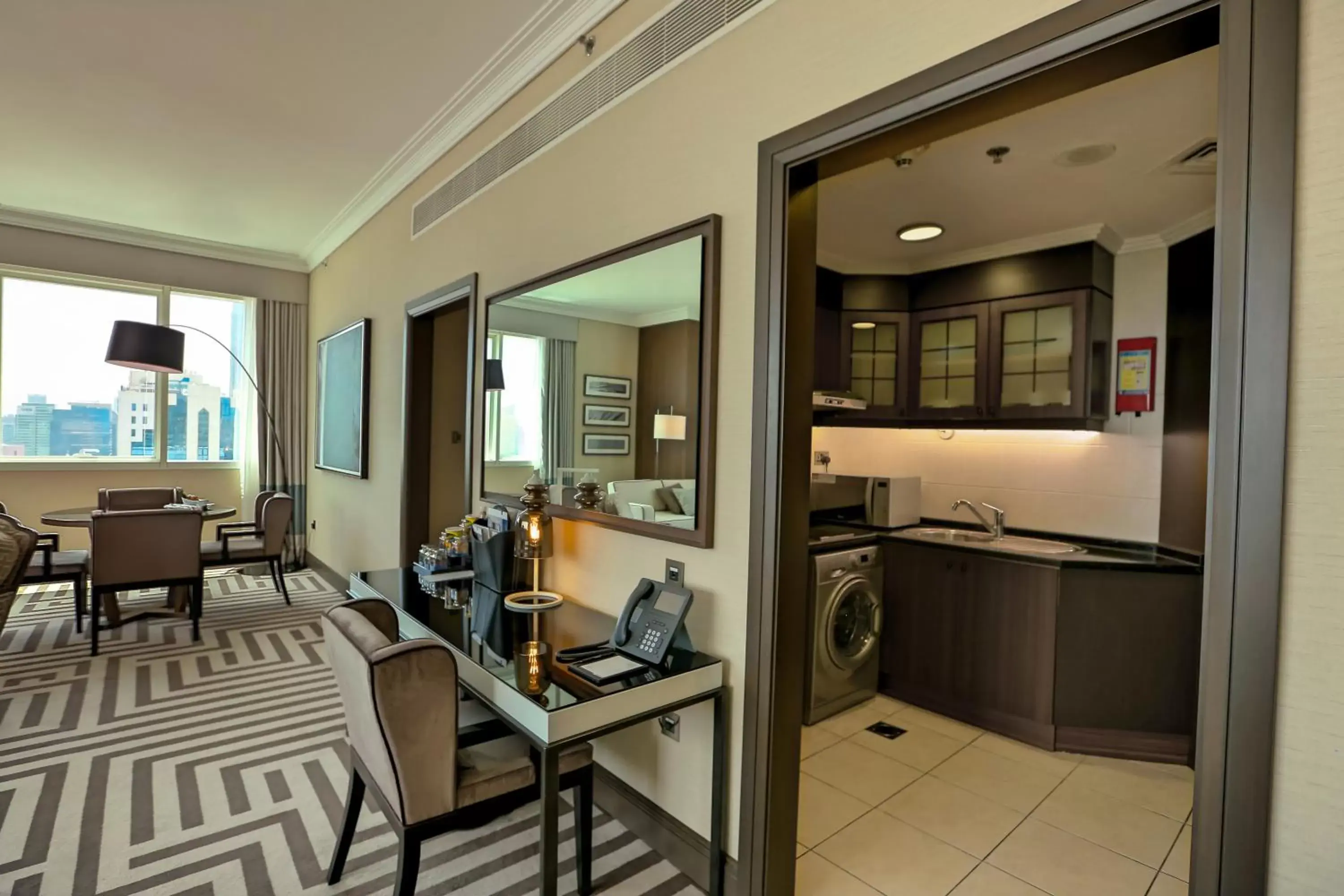 Bedroom, Kitchen/Kitchenette in Al Maha Arjaan by Rotana