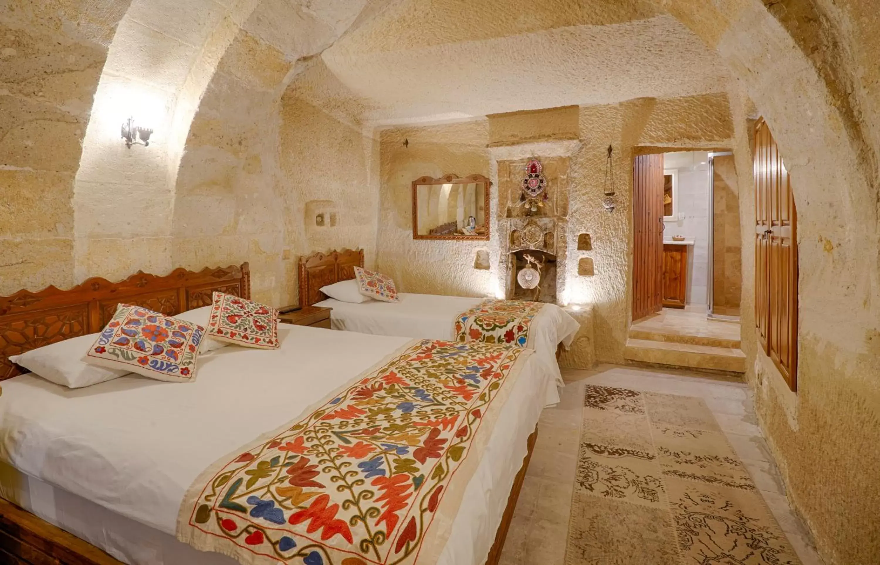 Bed in Tulip Cave Suites