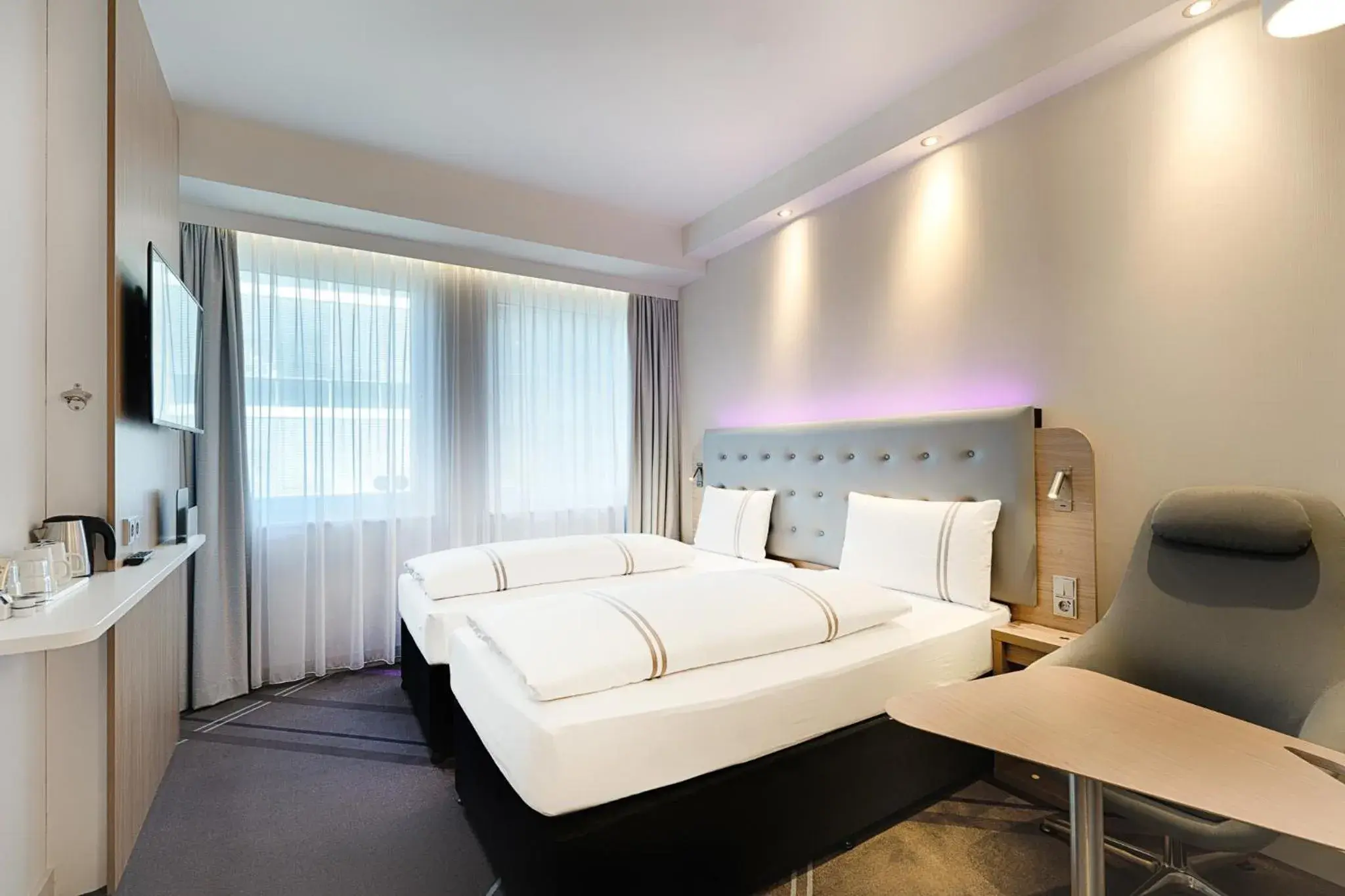 Bedroom, Seating Area in acom-Hotel Munich